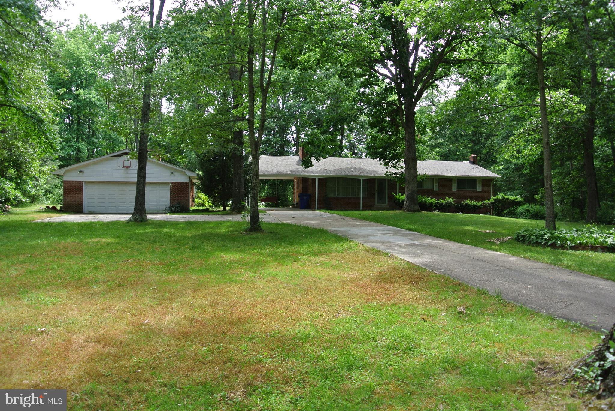 Enjoy a relaxing swim in the pool no matter what the weather is doing. This immaculate rambler boasts an INDOOR POOL, gleaming hardwood floors, Huge Back Yard and the list goes on. Situated just outside La Plata on over three acres. Enjoy the convenience of being close to town with no town taxes. Oversized  garage for the mechanic of the house. Third full bath next to the pool.  New Pool Liner to be installed and all pool components to be serviced.  Eligible for 100% Financing thru USDA Rural Development if qualified.