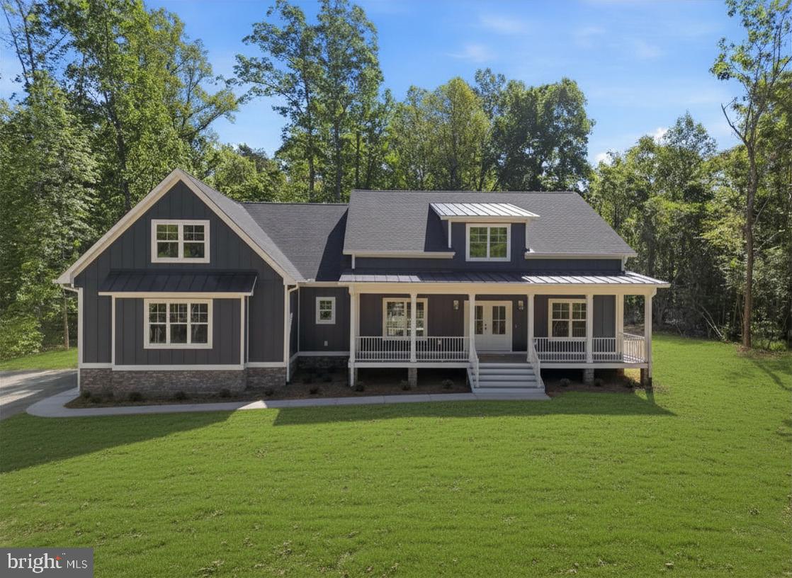 NEW CONSTRUCTION in Lighthouse Point on the private side of Lake Anna with an assigned covered boat slip and anticipated occupancy by late June. Combining timeless farmhouse architecture with the features today's buyers search for most, this 5-bedroom, 4.5-bath home offers exceptional space for gathering, entertaining, and spacious living just in time for summer on the lake. Built by J.D. Goodman Builder, Inc., a respected Virginia builder with more than 55 years of industry experience, this home reflects the quality craftsmanship, attention to detail, and thoughtful design that have earned J.D. Goodman homes a loyal following among Lake Anna buyers. Vaulted ceilings create an impressive first impression as the open-concept design unfolds into a showpiece kitchen featuring quartz countertops, an oversized island, and an enormous custom-outfitted walk-in pantry. The spacious family room serves as the heart of the home, creating an ideal setting for everything from quiet evenings to holiday gatherings and weekend entertaining. The main-level primary suite boasts privacy and ample space, highlighted by an enormous custom walk-in closet and magnificent ensuite bath with stunning tilework, double sinks & a private toilet room. Four additional bedrooms and multiple living areas provide spacious quarters for guests, a home office, fitness room, or recreation space. Designed with both everyday living and extended stays in mind, this floor plan offers exceptional room and functionality for today’s discerning buyerst. Outdoor living takes center stage with a 13' x 30' covered rear porch and a matching 13' x 30' concrete patio, creating over 700 square feet of outdoor entertaining space. The striking dark blue board & batten HardiePlank exterior, covered front porch, & side-load garage deliver standout low-maintenance curb appeal. Lighthouse Point is one of Lake Anna's premier lake-access communities, offering private-side water access, an assigned covered boat slip, & convenient proximity to marinas, waterfront dining, local wineries, breweries, and year-round recreation. Spend less time launching and storing your boat & more time enjoying everything Lake Anna has to offer as the boat slip is within walking distance.The home is nearing completion, with the certificate of occupancy anticipated by late June. Builder closing cost assistance is available with the preferred lender. (Grass edited in first photo)