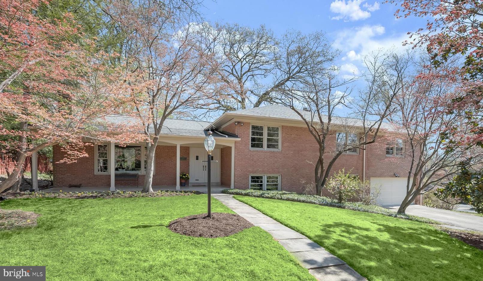 Spacious, expanded, level entry home in Kenwood Park with a lovely front porch. The free flowing main level floor plan includes the Foyer, Living/Dining Ell, table sized Kitchen and a skylit, cathedral ceiling Family room. Upstairs (half a flight) you'll find four bedrooms, one of which is a Fabulous Primary Suite with awesome "new" Primary Bath and Sitting room. Stylishly updated Hall Bath too! Bright, spacious rooms in a versatile floor plan for every need.<br/><br/>The next level down  from the main (half a flight) has a huge, bright room with gleaming hardwood flooring, the second fireplace and a built-in wet bar. Sliding glass doors lead to a rear patio and there are large windows for lots of light. This level also has a large room with built-in shelves that can be the 5th Bedroom or a terrific Office. A renovated full bath is on this fully out of ground level, as well as the two car garage!<br/><br/>The basement level is finished too and offers an open room with tile flooring. The laundry and utility rooms are on this level along with big shelved closets for ample storage.<br/><br/>In addition to full renovations of the two baths upstairs, recent improvements include: New roof in 2022; Two New heat pumps in 2023; New clothes dryer 2023; New A/C compressor in 2024; New water heater in 2025; the electric panel was new in 2018. This 5 bedroom home is a short walk to Walt Whitman High School and only a short drive to Pyle Middle School. The location is convenient to Downtown Bethesda and an easy commute into DC. Ride-On bus top two blocks away on Whittier Blvd. You should see this one right away!
