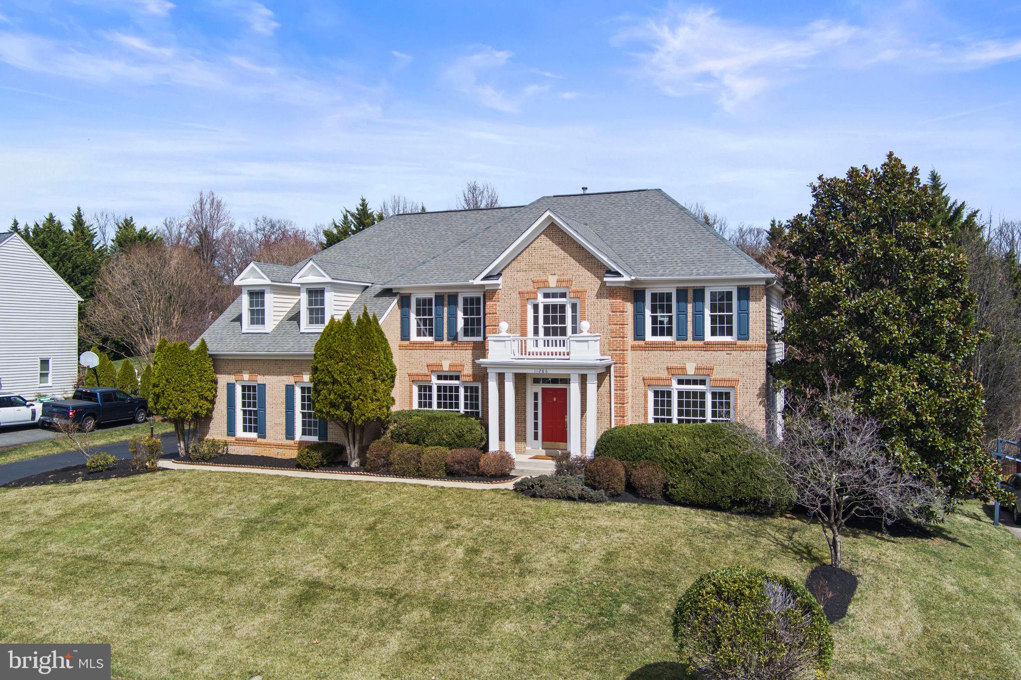 Welcome to 11286 Stones Throw Drive, a beautifully maintained brick colonial in the prestigious Estates at Wyndham Hills in Reston, VA. Nestled on a private 0.72-acre lot within the sought-after Langley High School pyramid, this home offers over 5,300 square feet of refined living space with thoughtful upgrades and timeless charm.

Inside, the spacious floor plan features four bedrooms, four and a half bathrooms, and a fully finished lower level with an optional fifth bedroom. The gourmet kitchen is a chef’s delight, complete with modern appliances, ample counter space, and a functional layout perfect for both everyday living and entertaining. Elegant moldings, hardwood floors, and large windows bring warmth and sophistication to the formal dining room, living room, and inviting family room.

The primary suite is a true retreat, offering a spa-like ensuite bathroom with dual vanities, a soaking tub, a separate shower, and generous closet space. The additional bedrooms provide comfort and privacy, while the finished lower level offers exceptional flexibility. A professionally designed home theater is ready for movie nights, and the spacious recreation area is perfect for entertaining, workouts, or relaxing.

Outside, the beautifully landscaped yard provides a peaceful escape, with plenty of space for outdoor gatherings or quiet moments surrounded by nature. The home also features a two-car garage and a 2019 roof replacement for added peace of mind. Plus, as part of the Reston Association, you’ll have access to an incredible array of amenities, including pools, tennis courts, miles of trails, lakes, and community events—offering a lifestyle that blends luxury with convenience.

Conveniently located near major commuter routes, shopping, dining, and recreational amenities, this exceptional property offers the perfect balance of elegance, comfort, and an unbeatable location. Don’t miss this rare opportunity to own a stunning home in one of Northern Virginia’s most desirable neighborhoods!