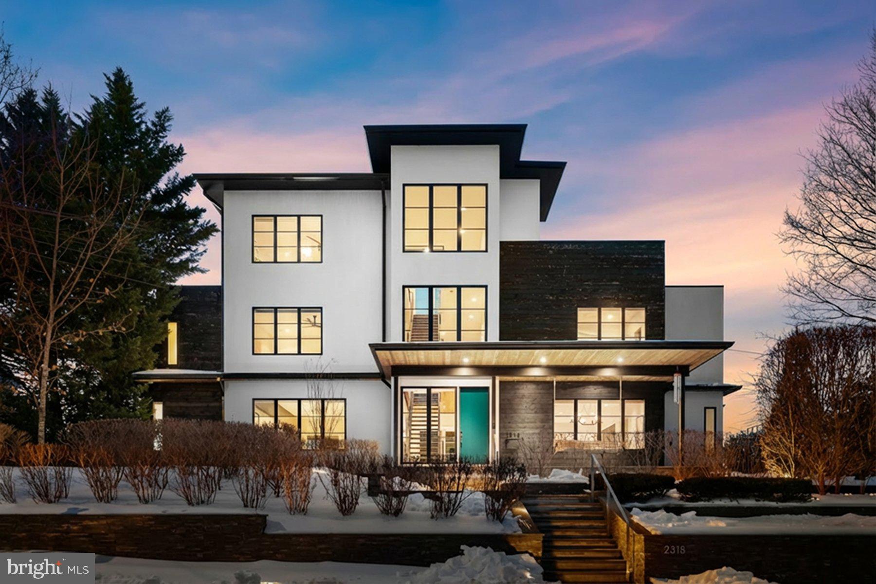 *Just Listed & Open Sunday* A modern architectural statement designed by ODE Design (formerly Sagatov Design+Build)  in 2015, this exceptional residence combines striking design, luxury finishes, and thoughtful functionality, set on one of Arlington’s rare elevated sites with panoramic views of the DC landscape. The four-level custom home offers approximately 6,700 square feet of meticulously designed living space, serviced by an elevator to all levels. Highlights include a top-floor kitchenette and an expansive rooftop terrace with panoramic Washington, DC views and an outdoor fire pit—ideal for memorable entertaining.

The main residence features five bedrooms and four-and-a-half baths, with refined architectural details throughout, including soaring ceilings, a dramatic steel and wood staircase, and expansive walls of glass. The chef’s kitchen is outfitted with a full-size panel-front refrigerator and freezer, large wine storage fridge, built-in countertop steamer, and a premium appliance package. The kitchen flows seamlessly into the family room, where large sliders open to a screened porch and outdoor kitchen. Indoor-outdoor living is enhanced by a screened porch, outdoor kitchen with built-in grill and pizza oven, putting green, and professionally designed private grounds with irrigation, landscape lighting and basketball pad. 

The third level is anchored by the primary suite, featuring a gas fireplace, dual walk-in closets, and a spa-inspired bath with a skylit walk-in shower, soaking tub, double vanities, and private water closet. Two additional bedrooms on this level offer custom closet systems, en-suite baths, and large windows with tailored window treatments. A well-appointed laundry room completes the floor, with a folding station, hanging rack, and ample storage.

The lower level includes a spacious recreation room with gas fireplace, a fifth bedroom and full bath, a large storage room with built-in organization, and a utility room equipped with a second refrigerator and dog-washing station. A standout feature is the underground tunnel connecting the main house to the 1,320-square-foot three-car garage, topped by a private one-bedroom, one-bath apartment—perfect for guests or  au pair. Additional highlights include solar panels with Tesla battery backup, whole house generator for peace of mind, heated driveway and walkways, invisible dog fence, landscape design by Brinitzer Landscape Architecture, built-in speakers and comprehensive smart and energy-efficient features throughout. A house like this is rarely available and the A+ location makes this a property a must see.