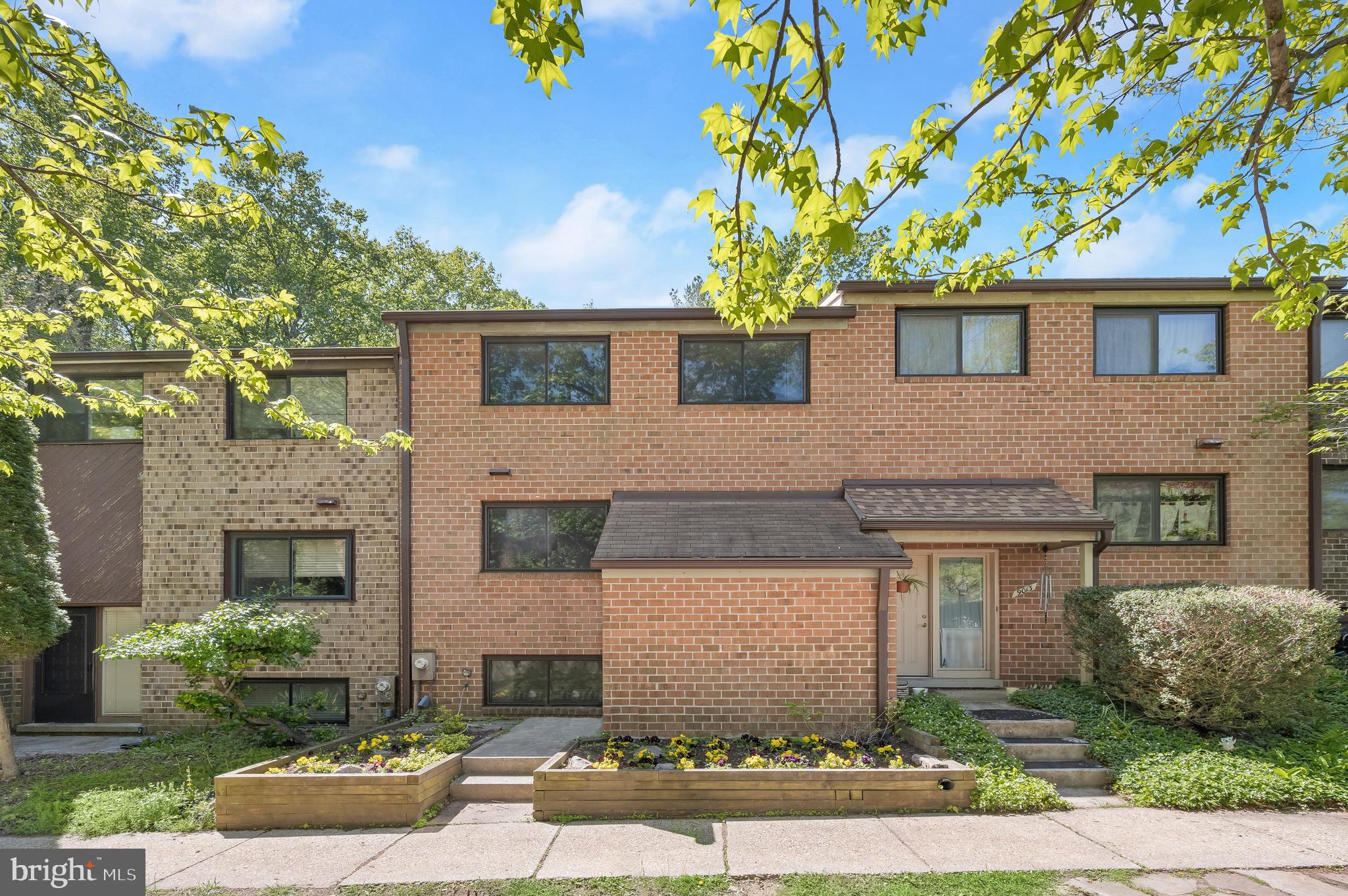 OPEN HOUSE CANCELLED< UNDER CONTRACT. Spacious, finished three-level townhome in vibrant Columbia with inviting curb appeal and attractive landscaping. The main level offers an open-concept living and dining area with sliding door access to an expansive deck overlooking peaceful, tree-lined views, ideal for outdoor relaxation and entertaining.
The large kitchen features granite countertops, a center island, rich wood cabinetry, a mosaic tile backsplash, and a sunny breakfast nook. Upstairs, the primary bedroom includes a private en-suite bath with dual vanities, while two additional bedrooms and a full hall bathroom complete the level.  The lower level provides a comfortable family room with walkout access to a privacy-fenced yard and brick patio, a versatile bonus room, and a spacious utility and storage room with built-in shelving. Perfectly located with hiking trails and a tot lot just behind the home, and convenient to major commuter routes, shopping, dining, and entertainment.  Some photos have been virtually staged.