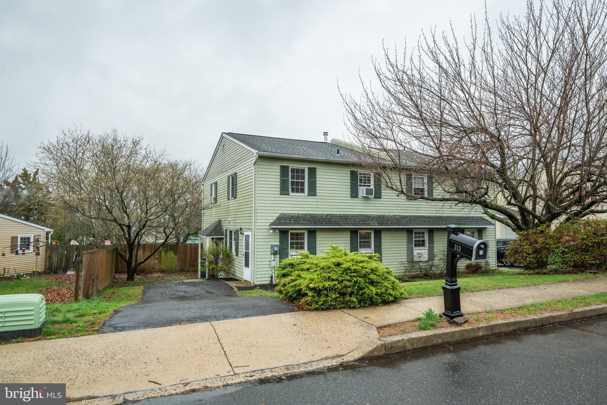 Welcome home!  Tucked in Perkasie Borough, let's take a look through this large Parkridge 3BR/1.5BA Twin. 
As you park on your personal driveway, you will notice a fenced in yard in the back and a landscaped flower bed out front.  Walking through the main door you are met by a  massive living room (22x13). There is plenty of room for relaxing and entertaining in this carpeted living room,  with a sliding door that provides access to the large backyard. Located right next to the living room is a powder room as well for a main floor bathroom. Walk up some  stairs to find the dining room that transitions well into the spacious kitchen with beautiful flooring, stainless steel appliances and plenty of counter top space. Off the kitchen, you will also find the mud room which also has a 2nd entrance from the driveway as well. Upstairs 3 bedrooms are located, the two ancillary bedrooms boast good size and great closet space.  The primary bedroom is massive like the living room, complete with walk-in closet.  The laundry room is located in the full bathroom between all 3 bedrooms. Fresh paint in the hallways and new ercarpet in the living room, hallway, stairs and 2 of the 3 bedrooms. Out back you'll find a spacious fully fenced in backyard perfect for entertaining.