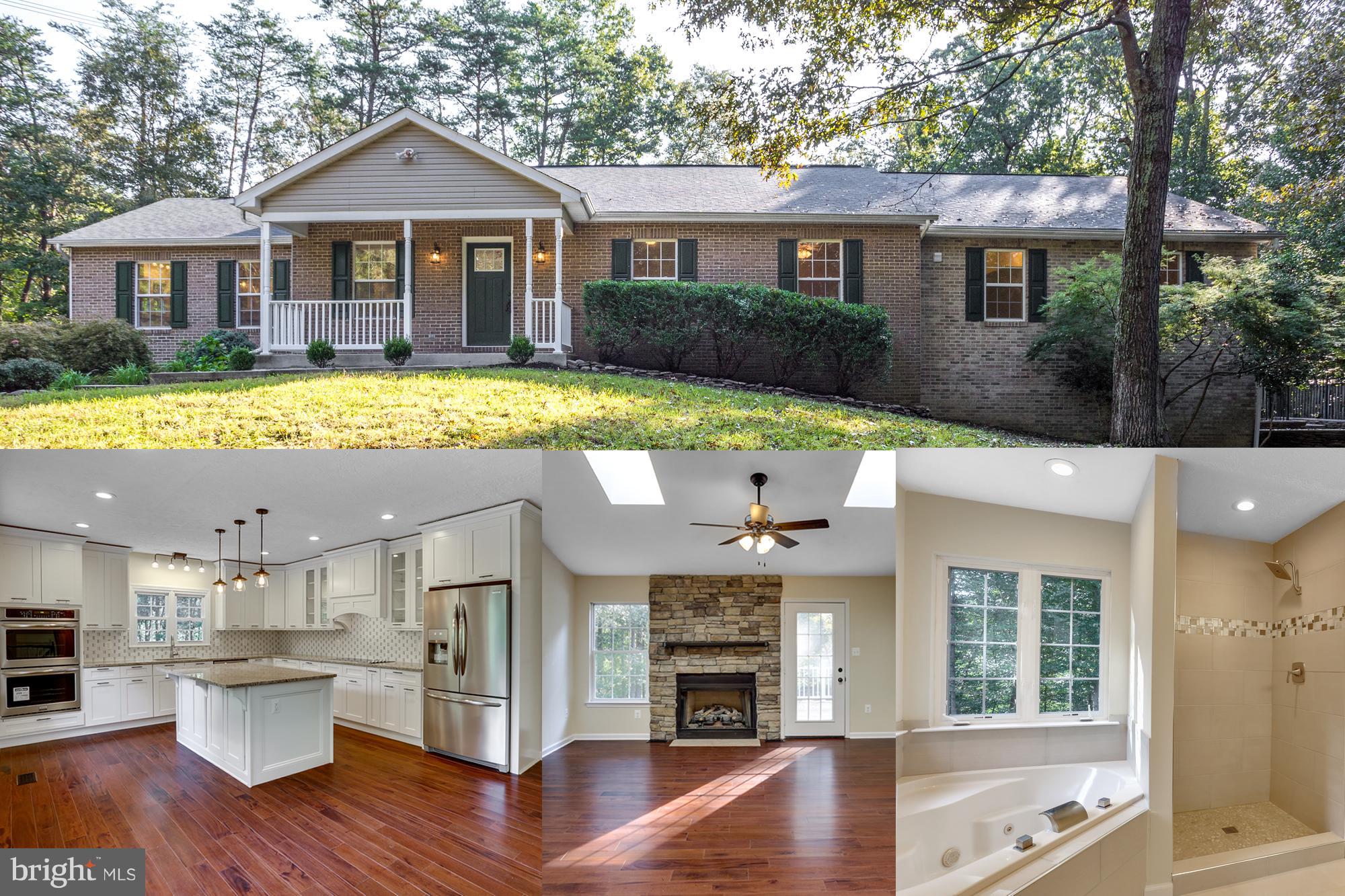 Welcome to your private oasis! Absolutely stunning home with over 4,000 sq ft totally renovated on 4 acres.  Features gourmet kitchen w/granite, double oven, upgraded cabinets, hardwood floors, 2 master BRs, 2 laundry rooms, finished basement w/full bar & fireplace. Basement has in-law suite or rental potential. Relax on the deck & patio or entertain in the cabana. Extended & circular driveway. No HOA!