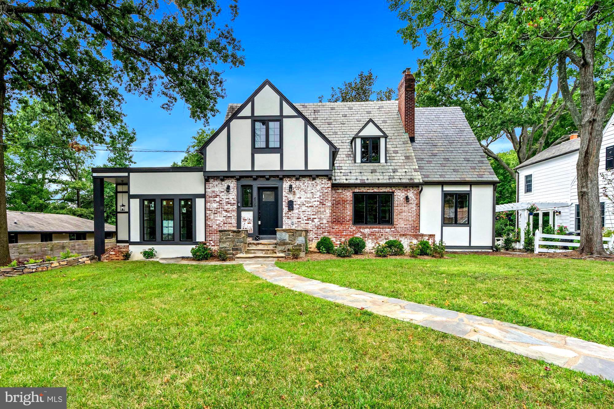 Come see what the excitement is all about in this utterly charming Dutch Tudor set on a large, maturely landscaped lot located in the idyllic Clover/College Park neighborhood of  Alexandria City. Boasting over 3800SF of top-of-the-line features, 406 Yale is a complete down to the studs renovation with full layout reconfiguration. Truly renovated top to bottom including all systems, layout, electrical, plumbing, insulation, appliances, kitchen, bathrooms, ductwork and more.  A truly move-in ready, fully modernized home with all the charm of yesteryear. Don't miss the video!

Historic charm meets modern day versatility and function. From the stunning slate roof with dark 6" gutters, new exterior color scheme, modernized black windows and new doors, beautiful stone walkways and brick retaining walls to the 4-board fencing, Brazilian Ipe deck, mature landscaping and gorgeous new plantings, you will be charmed at each and every turn. A versatile main level affords easy modern day living & fantastic flow for effortless entertaining. This unique main level living features a spacious open family room with and large dining room fit for today's busy lifestyle with access to the solarium from both rooms. A custom chefs kitchen offers all new Kitchen-Aid professional grade gas range, refrigerator, dishwasher and microwave/oven combo, banquette dining and ample storage throughout. The kitchen opens to the spacious family room featuring a gas fireplace, recessed LED lighting, and access to the spacious flat rear yard via the solarium. In addition to communal areas, the main level offers an en-suite bedroom plus a half bath for your guests. The upper level features a Spacious Primary Bedroom with Spa-like Ensuite & large walk-in closet, an office/reading room plus an additional bedroom with ensuite bathroom. The finished lower level includes indoor and outdoor access, fully temperature conditioned garage (EV charger can be added) with ample storage at the dry bar, a media room/exercise/flex room, laundry room, plus 4th bedroom with full en suite bath.

This offering has all of the modern conveniences of 2022, with all the charm of 1930. Crafted with critical attention to detail (builder has hundreds of photos of the construction process-just ask-know exactly what you're purchasing!) Don't miss this rare opportunity to own a one of kind home located on a large lot with mature landscaping - a quiet oasis located just minutes to shopping, dining, Old Town, Pentagon, Washington DC and Amazon headquarters. 406 Yale with easy access to Duke Street, a main thoroughfare to Old Town, I-395 access, 1.5 miles to King Street Metro and VRE; minutes to Bradlee Shopping Centre, and dining/shopping.