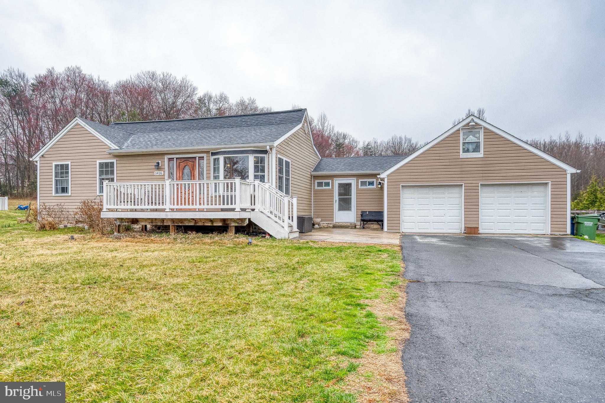 Welcome to 1416 Old Joppa Road, a renovated rancher situated on .92 acres. Enjoy the fenced rear yard with a serene and uninterrupted view of the trees off in the distance. Just inside the door you'll find a large living room open to the eat-in kitchen. There are hardwood floors along with crown and chair molding as well as a large bay window. The kitchen has gorgeous granite counters, high-end cabinetry as well as a backsplash and stainless steel appliances. Just steps away, you'll find a mudroom/drop zone with laundry and extra counter and cabinet space. The huge primary bedroom has neutral paint, ceiling fan and recessed lighting along with a walk-in closet and views of nature. The second bedroom is spacious and there is a renovated full bathroom between the two. The lower level has a great family room / spare room with luxury vinyl plank and a powder room. The oversized two-car garage has electric, workshop and stairs to a loft/attic space. The rear yard is massive and level, backing to trees.