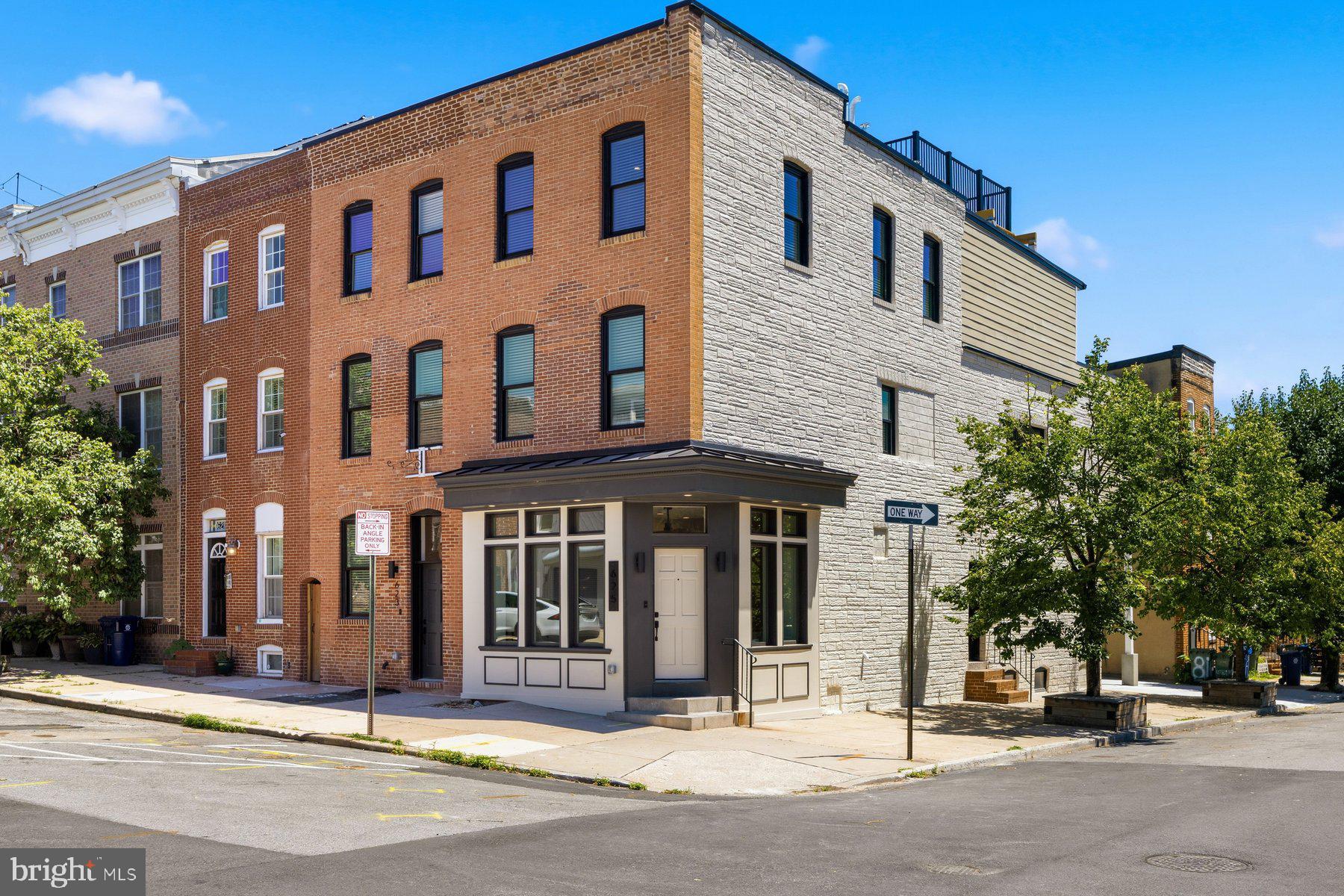 This stunning and completely renovated 5BR/4.5BA Townhome sits on the corner in the quiet neighborhood of Canton and offers a private parking pad, two rooftop decks and so much more. 
Step through the front door into a home filled with tons of natural light especially from the stunning front windows, high ceilings, crown moldings, luxury lighting fixtures, recessed lighting, and luxury flooring.  The main floor features an open concept living room, dining room, and stunning kitchen.  The kitchen features mixed metals with gold accents and stainless steel appliances, including a slide-in gas range, a custom range hood, and a microwave drawer. The cabinets, finished with crown molding, are abundant and include a pantry cabinet, sleek quartz countertops with a beautifully tiled backsplash, and an island featuring a stainless sink, pendant lights, and breakfast seating for three or more. Tucked behind the kitchen, down a few steps is a mud room with access to the parking pad and a half bath.   On the second floor are two secondary sized bedrooms: one featuring a private full bath with a walk-in shower, a full bath, a laundry closet, and a cozy family room or home office.  The third floor also features a sizable secondary bedroom, a full bath, and a grand sized primary bedroom with a large walk-in/walk-through closet leading to an en suite that includes a double sink vanity and a large walk-in shower, plus access to a private roof-top deck.  Take the stairs to the rooftop deck overlooking the amazing skyline.  This move-in-ready home is ideal for any new homeowner and is located near shopping, restaurants, and commuter routes. 

Fully permitted renovation with preliminary CHAP approval (pending final review), now nearing final completion over the next few weeks! Take advantage of significant 10-year tax savings with a current CHAP pre-renovation tax basis of just $215,000.
