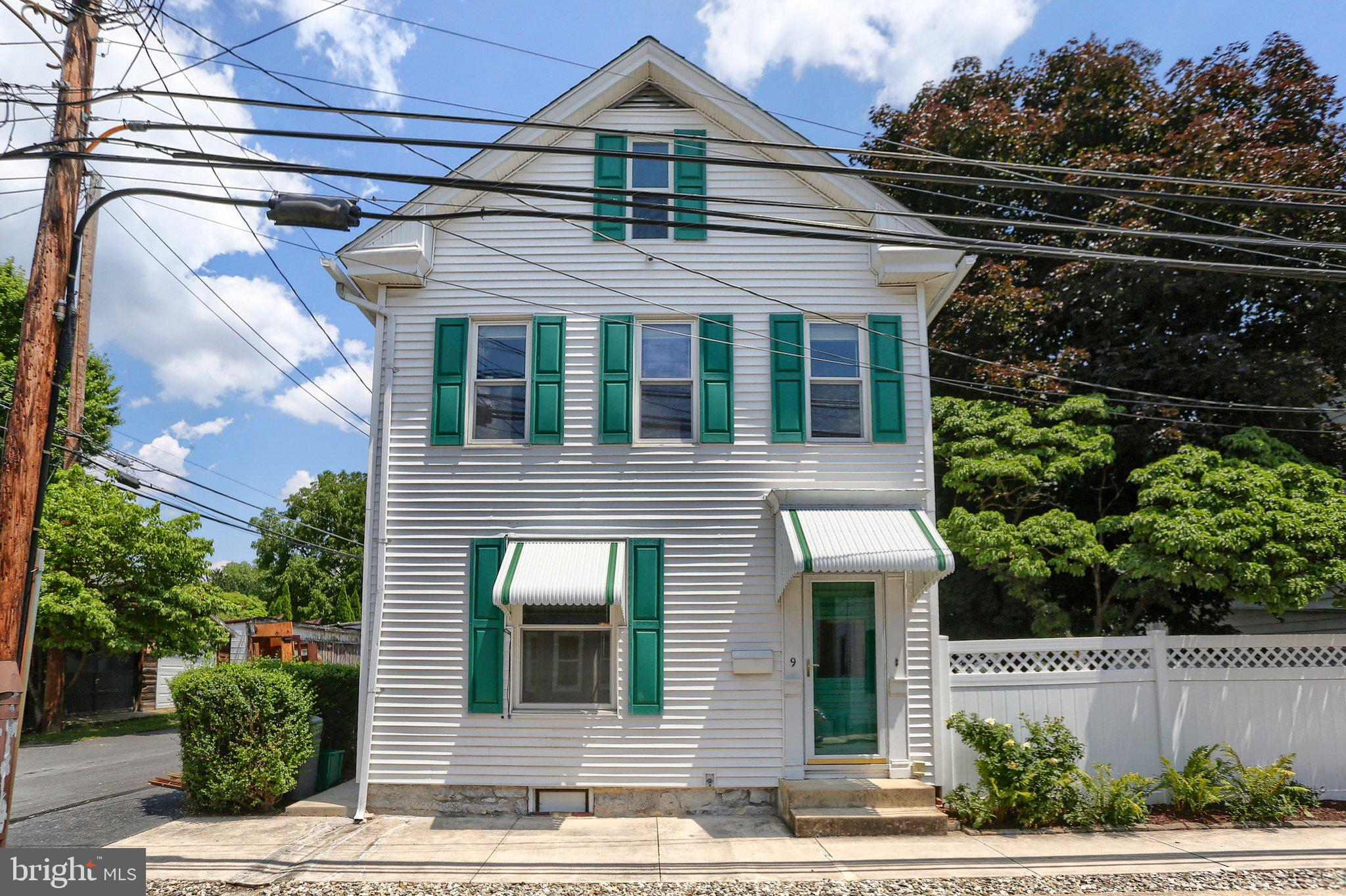 Own a piece of history with this beautifully maintained 1900 Victorian home nestled in the heart of the Historic District. Offering 3 bedrooms, this timeless residence seamlessly blends historic charm with modern updates. The beautifully remodeled kitchen features polished granite countertops, a spacious center island, and abundant cabinetry, creating the perfect space for everyday living and entertaining. Throughout the home, gleaming wood floors, exquisite original chestnut trim, and classic pocket doors showcase the exceptional craftsmanship and character that define this remarkable property. Replacement windows provide added efficiency while preserving its historic appeal.

Situated on a beautifully landscaped double lot with a fenced yard, this exceptional property offers plenty of space for entertaining, gardening, pets, or simply relaxing outdoors. Completing the property is a spacious three-car garage, providing abundant room for vehicles, storage, hobbies, or a workshop. Rich in architectural detail and thoughtfully updated for today's lifestyle, this distinctive Victorian presents a rare opportunity to own a piece of history in one of the area's most desirable Historic District neighborhoods. Some rooms have been virtually staged to enhance the viewing and show possible furniture placement.