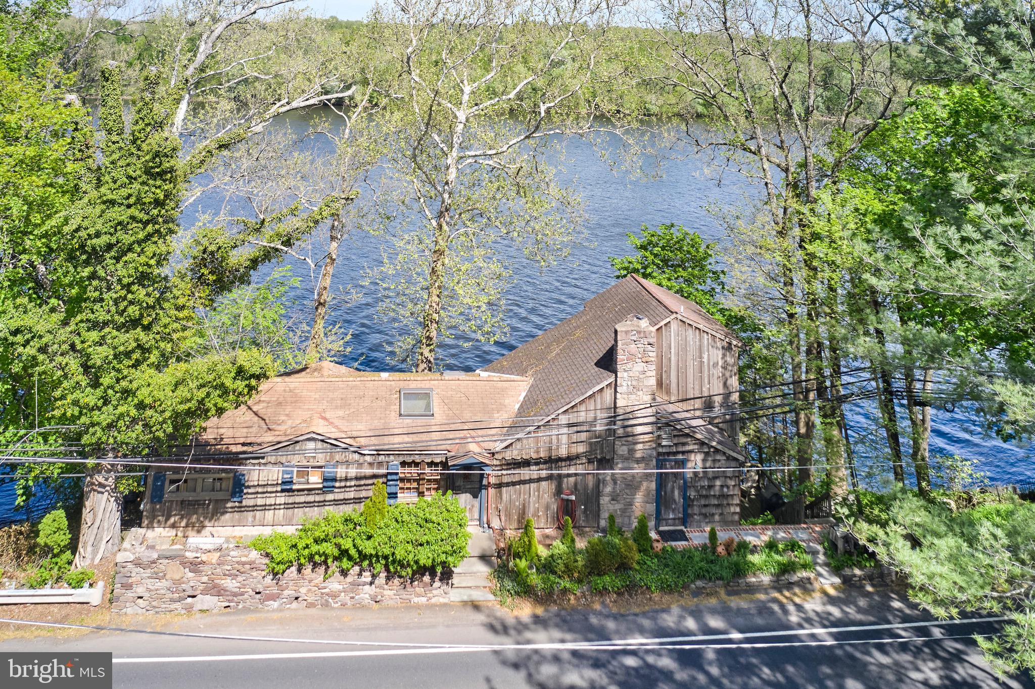 Welcome to 266 N Main Street, a rare waterfront opportunity in the heart of New Hope. This 3-bedroom, 3-bath home sits directly along the Delaware River and offers stunning views from a large rear deck. Inside, the home features a flexible layout, including a loft space and multiple living areas, offering great potential for customization to fit your style and needs. Located in New Hope’s vibrant downtown, you’ll find restaurants, galleries, and shops that make the town one of Bucks County’s most beloved destinations. Waterfront properties here are few and far between, and this one offers the chance to create something truly special in a picturesque community. Whether you’re looking for a weekend escape or a full-time residence, 266 N Main Street presents a unique opportunity to own along the Delaware River in one of Pennsylvania’s most charming towns.