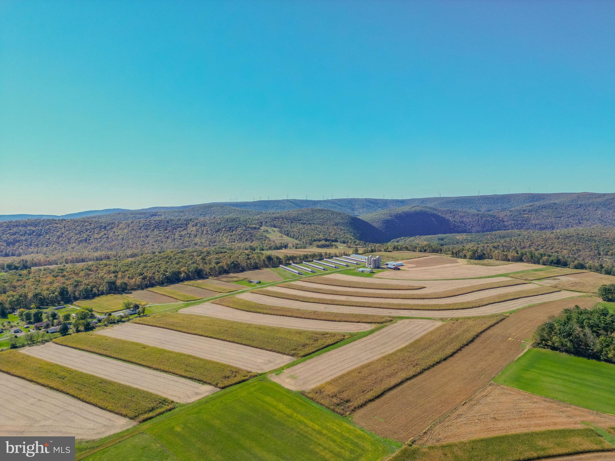 395 +/- acre riverfront farm consisting of 315 +/- tillable acres and 80 +/- acres of native woodland. The site was built to house a reproductive technology business for cattle genetics but it is not currently in use. Property has 8 bull barns  - 7 are (29x465) and 1 is (65x475).  They are similar to a dairy or indoor monoslope cattle barns and have concrete floors with individual pens with heavy duty steel pen dividers. Other buildings include a shop with office and bathrooms, 2 hoop barns for hay and shavings, a machinery shed, 3 (24'x68') poured silos, 2 ( 30'x80') silos, a feed room, calf barn, storage shed, 3 smaller barns, and a 3-bed, 1.5 bath house. Excellent hunting with lots of deer, turkey and bear. A very secluded setting with mostly flat topography.