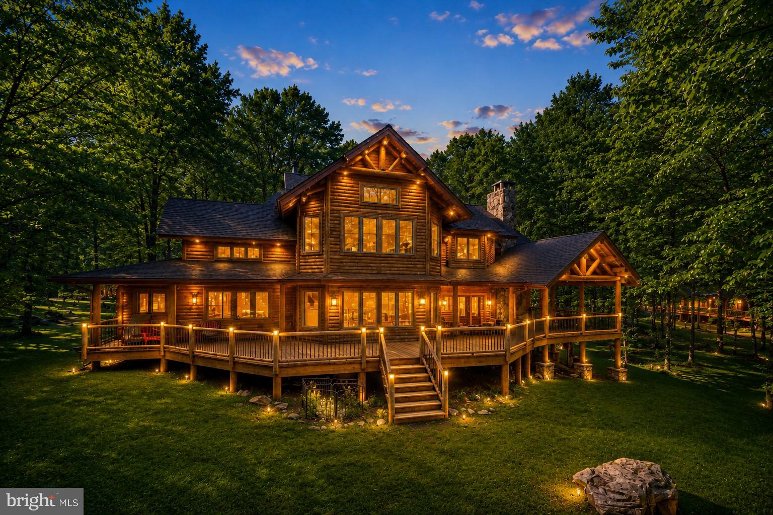 Luxury golf-front living atop Wisp Resort! Situated along the 12th fairway of the prestigious Lodestone Golf Course, this 5-bedroom, 4.5-bath mountain retreat offers over 5,000 square feet of beautifully designed living space. Soaring wood-clad ceilings, expansive windows, and a floor-to-ceiling stone fireplace create a warm and inviting atmosphere throughout the open-concept main living area. Fireplace wood-burning equipped with gas starter for convenience. Easily converted into a propane fireplace. The spacious kitchen features custom cabinetry, granite countertops, dual islands with wet-bar/beverage cooler, and a seamless flow into the gathering spaces—perfect for entertaining!  Great room features a proper built-in wet bar with plenty of cabinet space and wine chiller. The two generously sized primary suites enjoy peaceful golf course views, while multiple guest bedrooms and living areas provide room for family and friends. Outside you will find the best ferature of the house... A sprawling rear deck with a covered rustic stone fireplace overlooking the fairway, perfect for year-round enjoyment—rain or shine! Attached garage with tons of storage for outdoor toys, golf carts, or mower and a 220V car charger for electric-powered vehicles. An unbeatable location just minutes from Deep Creek Lake, Wisp skiing, hiking, dining, and four-season recreation. A premier mountain getaway with exceptional rental potential, or private retreat. Call today for details!