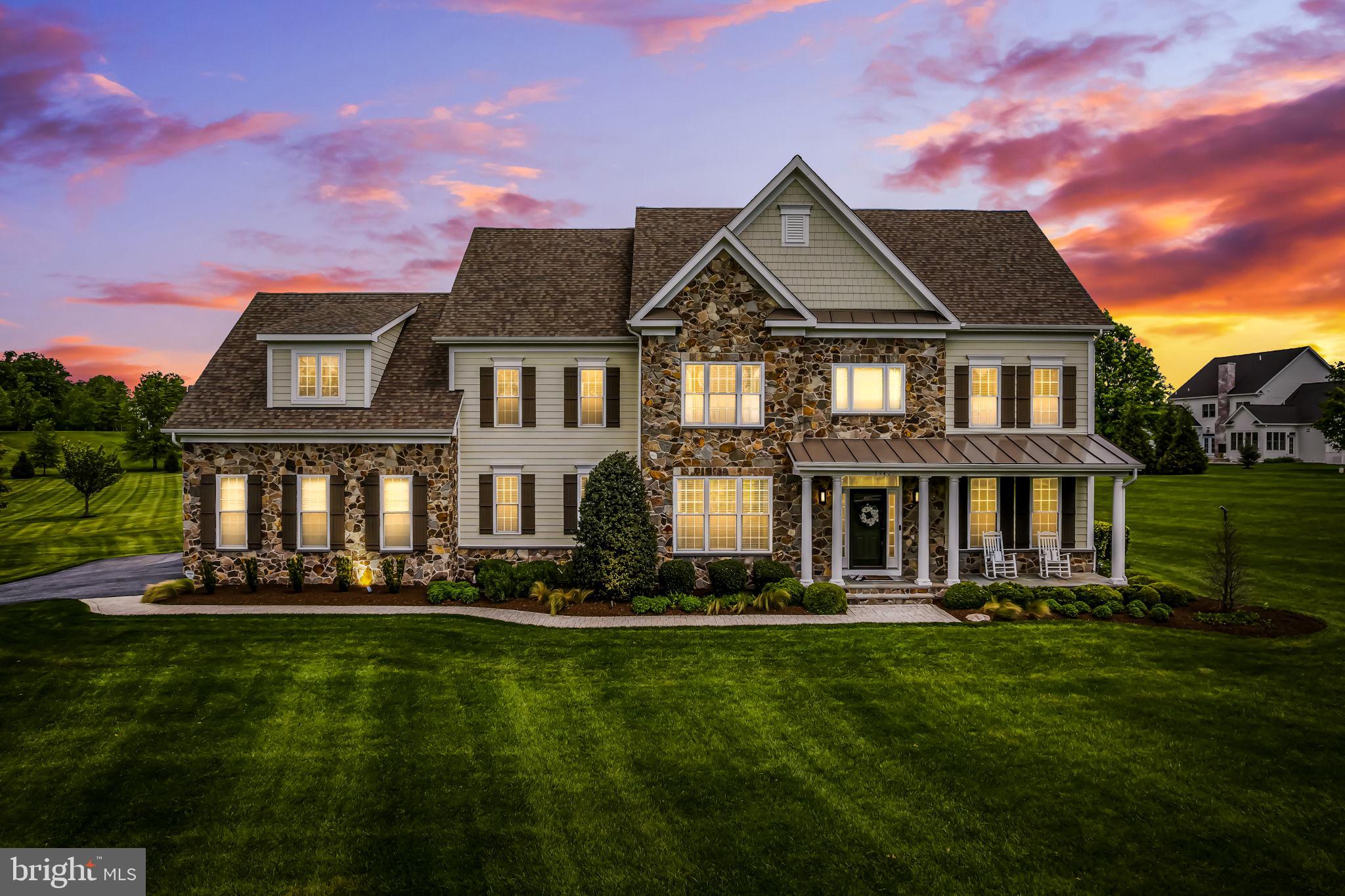 Tucked into one of Baltimore County's most exclusive and sought-after communities, this stunning colonial sits on 1.74 acres just steps from HCC (formerly Hillendale Club) golf course.
6 bedrooms and 5 full baths span more than 6,000 finished sq. ft., with 4,472 above grade and a fully finished lower level offering multiple rooms for whatever your life calls for: guest quarters, media, fitness, play or all of the above.
The entire home shows like a model. A chef's kitchen with a gourmet stove, large island, and breakfast bar overlooks a main level built for both daily routine and easy entertaining. The open plan includes a sunroom for casual dining, a beautiful living room with a gas fireplace and built-ins, a formal dining area, an office, a command center, and a mudroom, as well as a den and full bath.
Upstairs, the primary suite is a true retreat with two massive walk-in closets, a tray ceiling and a spa-like bathroom. Four more generously sized bedrooms round out the level, with one currently being used as a family room. Two additional full baths and a large laundry room complete the floor.
A three-car garage handles the practical side, and a lovely stone paver patio with built-in fire pit off the back extends the living space into the yard. Hunt Valley, Towson, and I-83 are all within easy reach, making the daily commute and weekend logistics genuinely simple.
Under 10 years old, this home shows like new construction without the wait.