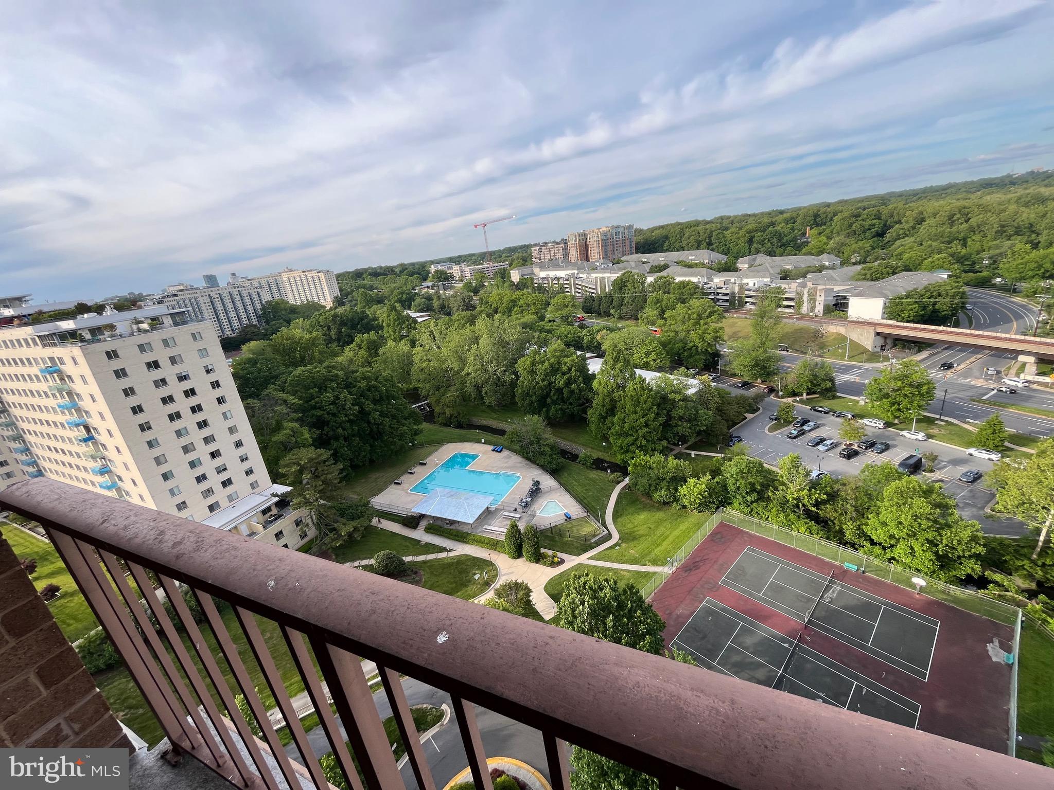 Handsomely renovated upper floor with great sun, balcony, full-size washer and dryer.  Additional parking spot in garage structure available for purchase additionally.  Extra storage is 6.5'w x 7'd x approx. 7'h, T2 level, Storage Room 4 also available for addtn purchase.  Metro is literally across the street, endless amenities like gym, pool, concierge, community room, grills, etc.