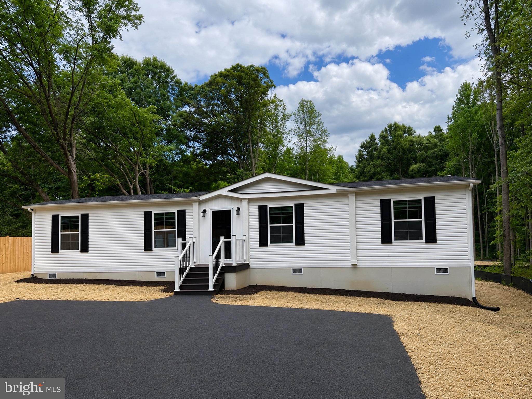 Experience the sought-after Lake Anna life in Spotsylvania County with this Brand New home on 2.09 private acres with No HOA, located just minutes from the lake and less than 2 miles from Lake Anna Winery. Offering 1,474 square feet of thoughtfully designed living space, this 3-bedroom, 2-bath home includes a 7-year new home warranty for added peace of mind.

The open-concept layout creates the perfect setting for both everyday living and entertaining, featuring a spacious living area that flows seamlessly into the dining area and kitchen. The kitchen is the heart of the home, showcasing stainless steel appliances, a large center island, walk-in pantry, and 42-inch overhead cabinets providing abundant storage and workspace.

The private owner’s suite is thoughtfully positioned on the opposite side of the home, creating a peaceful retreat. A charming barn door leads to the en-suite bath featuring dual vanities, a large walk-in shower, and two walk-in closets. Both secondary bedrooms also offer walk-in closets, providing exceptional storage throughout the home.

The utility room includes a laundry area with a utility sink, while a separate built-in desk and shelving area provides the perfect space for a home office, homework station, or household organization center.

Outside, enjoy the privacy and freedom of 2.09 acres, complete with a paved driveway and an incredibly large backyard offering endless possibilities for outdoor entertaining, recreation, gardening, or simply enjoying the peaceful surroundings.

Enjoy convenient access to boating, fishing, waterfront dining, wineries, breweries, marinas, and year-round recreation while still having the privacy and space you’ve been looking for. This move-in-ready home delivers the perfect combination of modern features, acreage, and location.