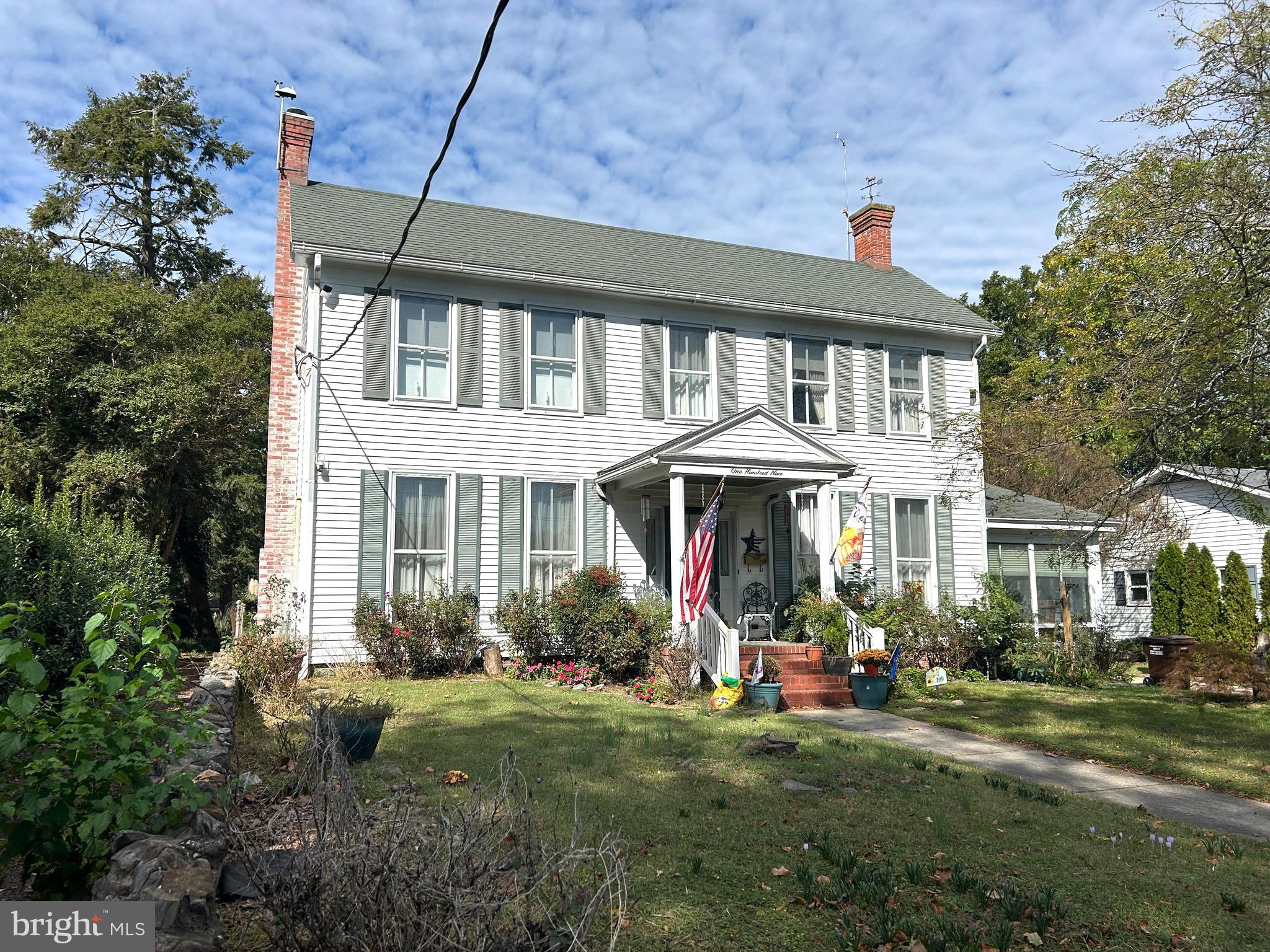 109 Mill St. is a prime location in the heart of West End Historic District,  which is deep in the heart of Cambridge, one of the city's most coveted streets, having homes owned by MD governors, mansions of  business tycoons who founded Phillips  Packing Co. (1902),  and Academy School(1903), registered as MD/Natl'l Historic Properties.  109 Mill is a hop, skip and jump  to the Choptank River,   considered a premier tributary of the Chesapeake Bay with its wide expanse, bountiful seafood, water sports and sightseeing.  Make note that the dwelling is in Flood Zone X and flood ins. not required.  On the shoreline are the city and yacht club marinas to lodge your boat and the Choptank River Lighthouse at Long Warf.  This  1919 home rests on a deep .28 acre lot with the rear yard having a deck, detached garage, shed and year old above ground pool  (depth 54"). The exterior has vinyl siding,  architectural shingle roof and several replacement windows. From a covered brick entry, the Colonial style home opens to a large living room next to the family room with wood stove, which flows into the formal dining room, which is next to a bedroom/office,  all of which have craftsman made hardwood floors.   There is also an all glassed heated sunroom. The kitchen is at the house rear equipped by SS appliances paired with a laundry room having washer/dryer, tankless hot water and  storage area. There are three second floor bedrooms. You have an easy stroll to the versatile downtown for business and pleasure, with professional and other service offices, bank, post office, public library, retail and last but not not least, fine restaurants/taverns.  Cambridge is in the midst of rebounding to the days of old when it was leader of the Shore, but all the while maintaining friendliness and  slower  pace of life,  why it's known as the land of pleasant living.

MAjOR PRICE IMPROVEMENT 12/26/25