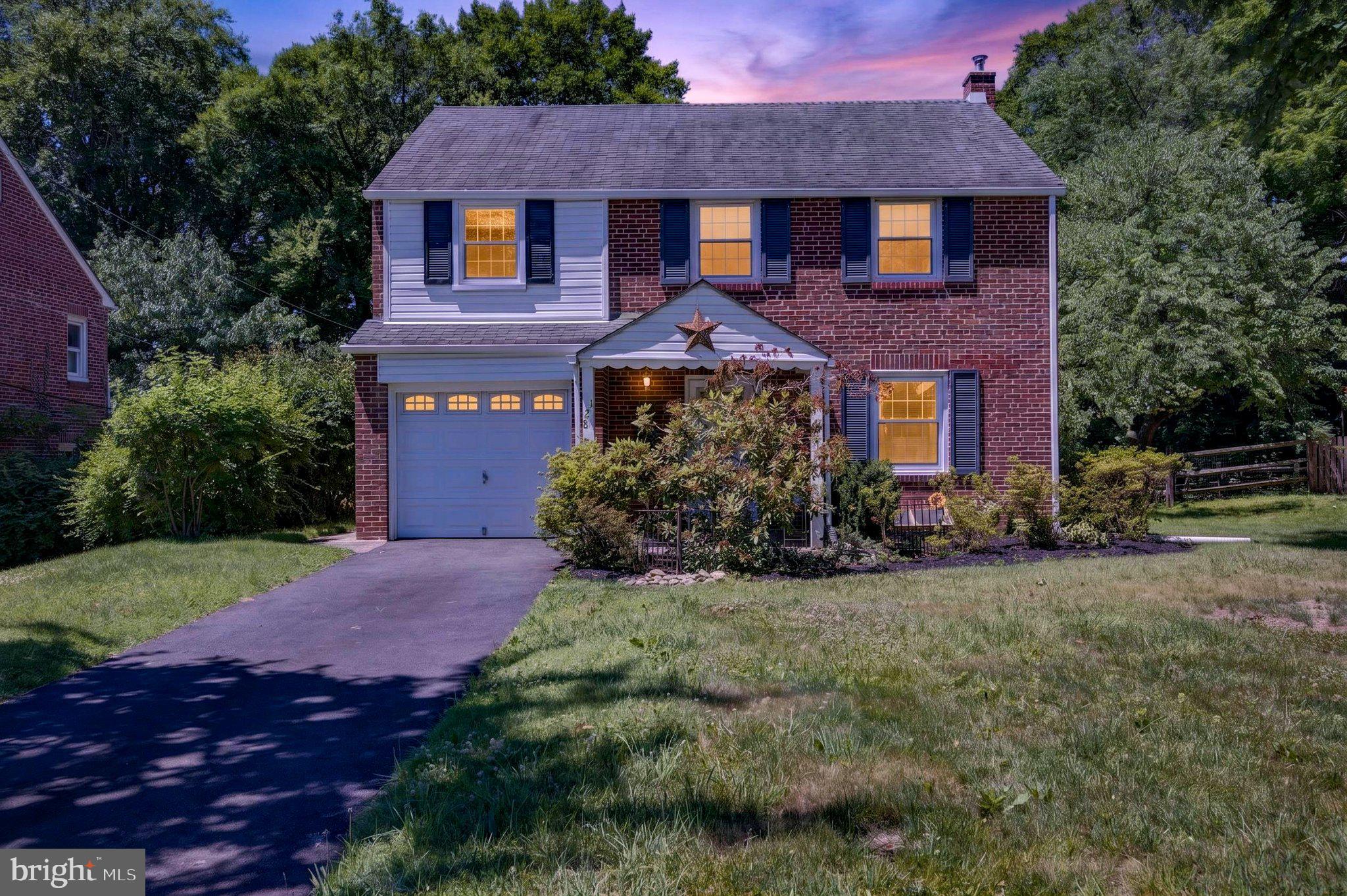 If you've been searching for a well-maintained, brick Colonial in a highly desirable neighborhood, 128 Boncouer Road is ready for its next chapter! With attractive curb appeal, a pretty lawn, and a one-car garage, this home welcomes you inside to a traditional layout filled with charm and warmth. The main level features a spacious living room with hardwood floors and abundant natural light, creating a comfortable gathering space for everyday living. A formal dining room with a coat closet sits adjacent to the eat-in kitchen, which offers access to the inviting patio and backyard. The finished basement provides additional living space and can easily serve as a recreation room, home office, or hobby space. A laundry area and convenient half bath add functionality to this level. Upstairs, you'll find four comfortable bedrooms with carpeting and closets. The full hall bath has vintage chic tile and offers an opportunity to add your own personal touches over time. Step outside to enjoy the backyard, featuring space for gardening, outdoor dining, relaxing, or entertaining family and friends. Located on a quiet residential street, the property is close to parks, shopping, dining, public transportation, major commuter routes, making it easy to enjoy everything the area has to offer.  This house has it all, including central air conditioning for the hot summer ahead. Come and make this gem yours today!