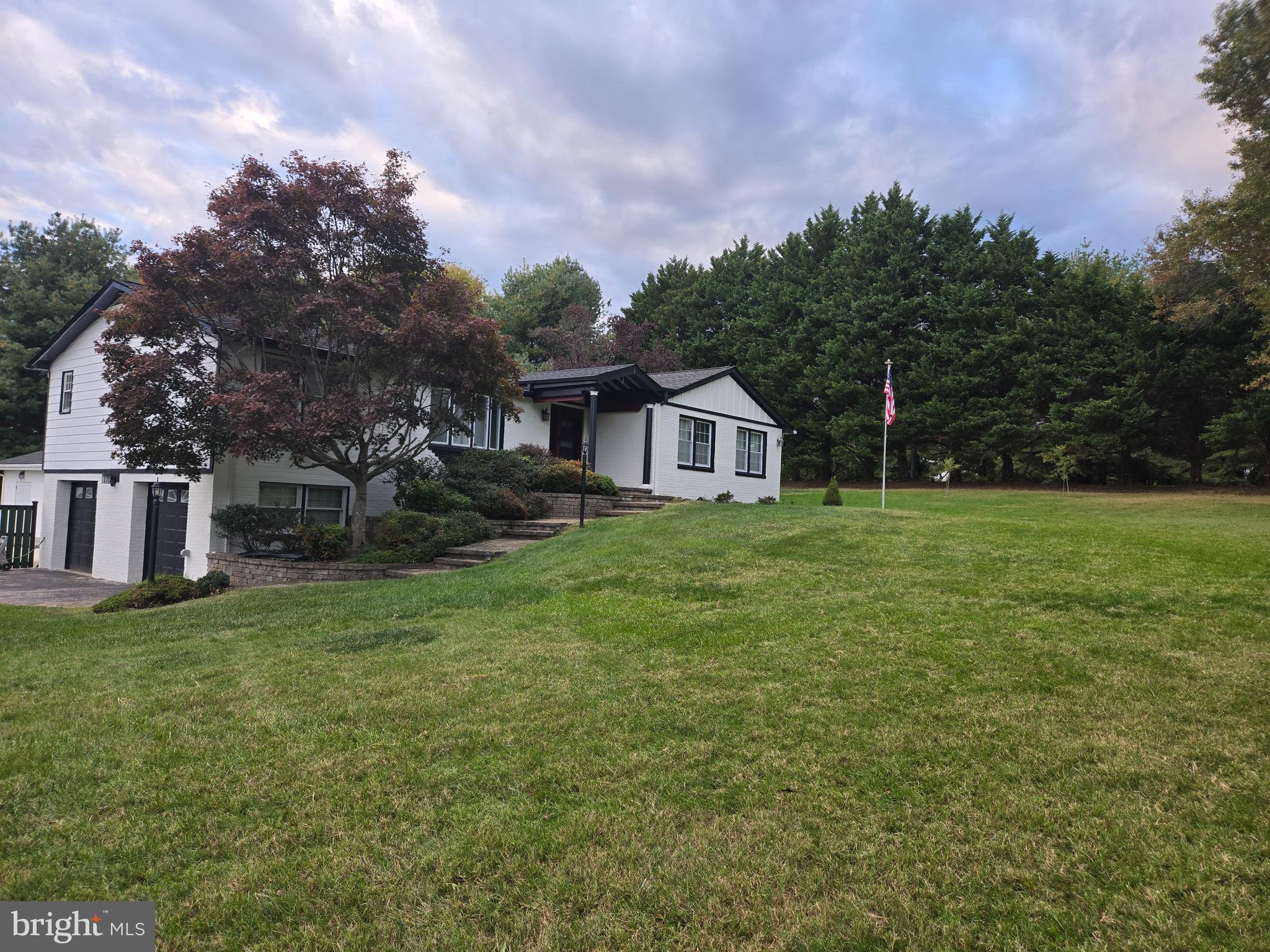 Ready to Move In! Ready for Hot Summer Days! Ready for Peace and Tranquility
Love the idea of a backyard that will remind you of a resort.
Welcome to 3300 Mount Airy Court—a beautifully remodeled home on 2.07 acres, offering 3,070 sq ft of finished living space (2,215 sq ft above grade and 855 sq ft below), located in a scenic neighborhood just 10 minutes from Annapolis and 30 minutes to Washington, D.C., and 30 minutes to BWI Airport.
Backyard & Entertaining:
Step outside to a backyard that will remind you of a resort, featuring a remodeled pool, pool house with outdoor fireplace, hammocks, grilling/dining area, and a sports field. Perfect for entertaining 50+ guests, hosting summer parties, or enjoying quiet family fun. The deck overlooking the pool is ideal for morning coffee, sunset views, or stargazing with loved ones.
Main-Level Living:
The first floor includes a large kitchen, dining, living, laundry, 2 full baths, 1 half bath, and 3 bedrooms, with  80% new hardwood floors. The kitchen boasts stainless steel appliances, generous counter space, pantry, and a pool-view sink. The primary bedroom includes hardwood floors, a large closet, and a versatile sunroom—perfect for reading, playing with kids, or hobbies.
Finished Basement:
The basement offers a cozy family room with fireplace, media area, refrigerator, sink, and full bath, plus an additional washer and dryer. It is perfect for romantic movie nights, game nights with friends, or a private guest retreat.
Additional Features:
• Basement-level 3-car garage with storage for tools and equipment
• Neighborhood is postcard-perfect with scenic walking areas, mature trees, and well-maintained homes
• The 2+ acre setting offers peace, privacy, and space to relax and enjoy quiet surroundings
Prime Location:
• 10 minutes to Annapolis—shops, waterfront dining, historic sites, the Naval Academy
• 30 minutes to Washington, D.C.—museums, monuments, and nightlife
• 30 minutes to BWI Airport
• 20 minutes to the New Carrollton Metro for easy commuting
This home offers a place to enjoy family and friends in every season, day or night, under $850K.