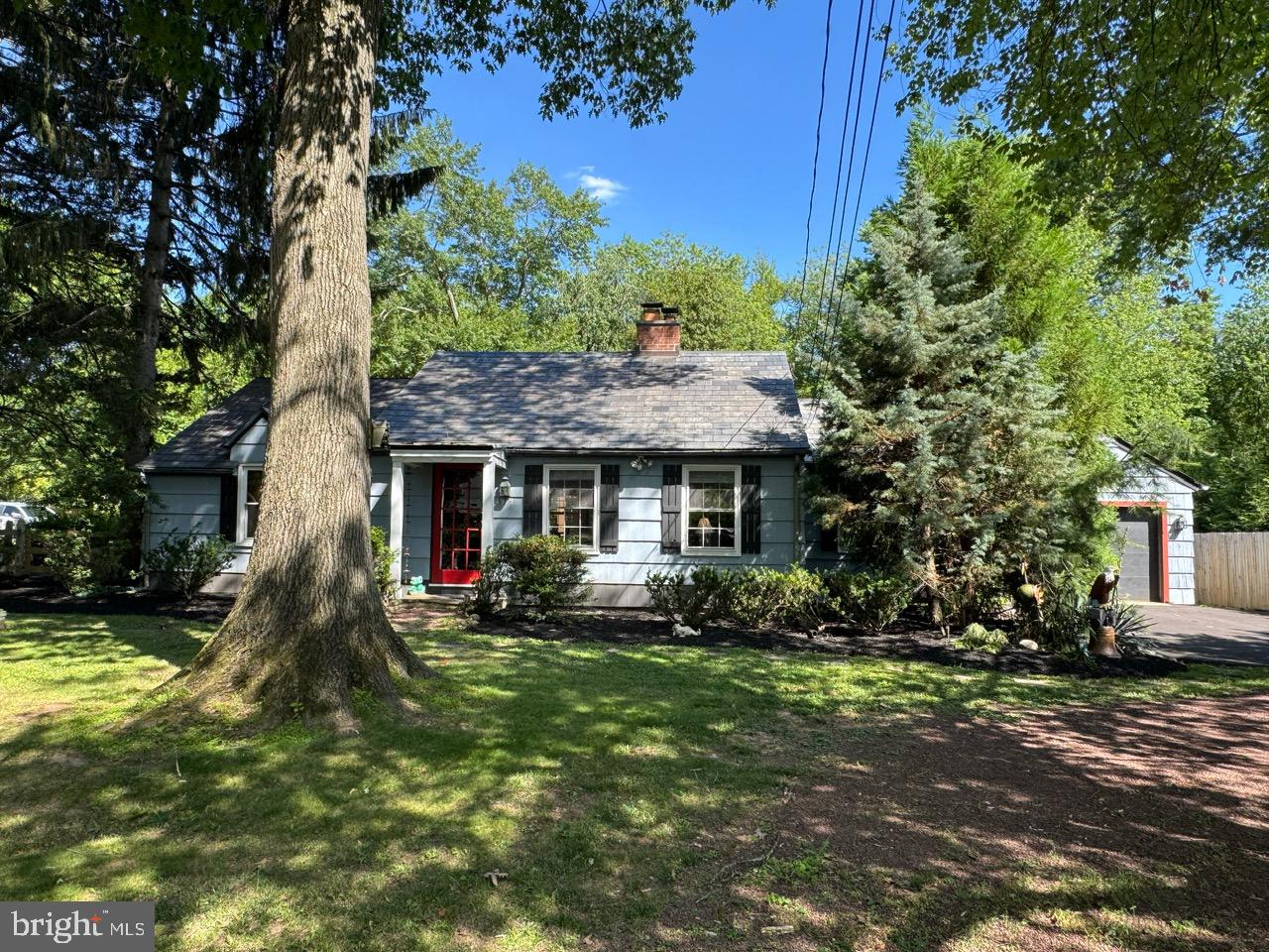 Nestled on a beautiful half-acre lot in Buckingham Township, this truly special ranch style single-family home offers charm, character, and exceptional outdoor living - with one level living! Complemented by a timeless slate roof, this home welcomes you with a living room featuring a fireplace and a dining room with a bay window overlooking the expansive deck and picturesque backyard. The updated kitchen is a chef's delight, boasting wood cabinetry with glass-front accents, a pantry cabinet, stainless steel appliances, dishwasher, beverage/wine refrigerator, dual refrigerator drawers, glass-top cooktop and built in oven, stainless steel sink with a drain board and butcher block countertops.

The spacious main level also includes a large breakfast area that opens to an impressive family room featuring hardwood floors, a cozy wood stove, and sliding glass doors leading to the rear deck, along with a second set of doors providing access to the front yard and driveway. Two bedrooms with hardwood floors include a generously sized primary bedroom and a second bedroom currently used as a home office. The oversized bathroom offers a double vanity, corner shower stall, creating a bright and open retreat. A large walk-in closet in the hallway and multiple storage closets near the living and dining areas provide abundant storage throughout the home.

Outdoor living is equally impressive. Relax beneath the pergola with shade cloth, entertain on the expansive deck, or enjoy the two-year-old gazebo overlooking the beautifully fenced backyard filled with lush, mature landscaping. Additional features include an oversized one-car garage with inside access and a large storage area, a spacious storage shed, some replacement windows, newer heating and central air conditioning systems, and a newer water heater,  and a basement that offers endless opportunities for storage and potential additional living space with your finishing touches.

Conveniently located just minutes from Doylestown, New Hope, and Peddler's Village, you'll enjoy easy access to exceptional dining, boutique shopping, parks, and cultural attractions, along with convenient access to major roadways for commuting. This unique property offers the perfect combination of comfort, character, and outdoor enjoyment.