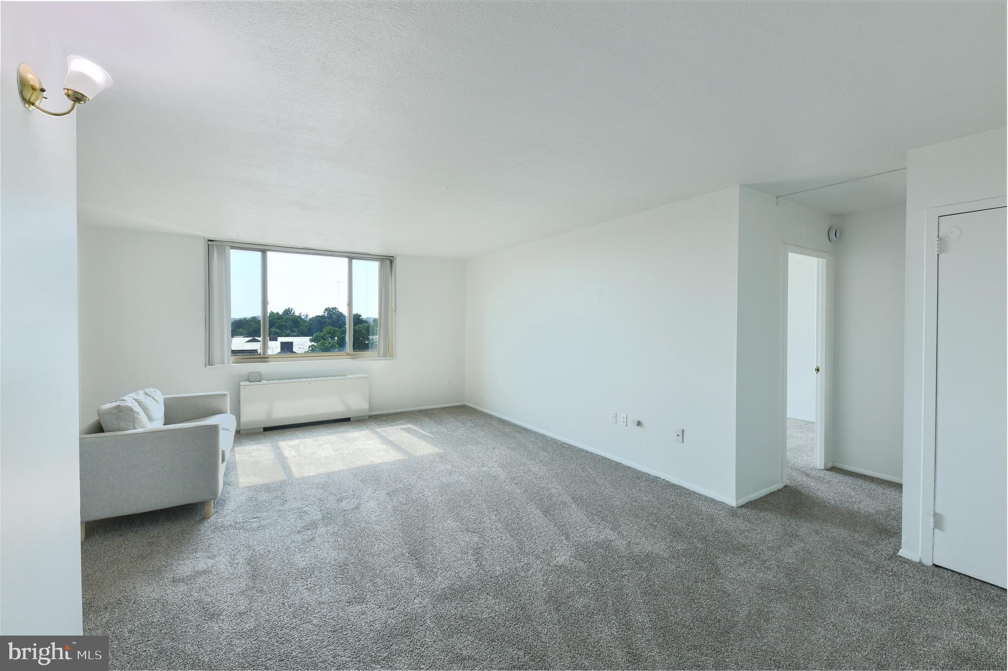 Welcome to 1 E University Pkwy Unit 908 a spacious 1-bedroom, 1-bathroom condo with incredible views overlooking Johns Hopkins University Campus, perfectly located next to the Johns Hopkins University campus in the heart of Charles Village/Guilford. This unit offers a rare opportunity to invest in a well-sized unit brimming with potential. It’s the perfect blank canvas for either a savvy investor or an owner-occupant looking to add personal touches and build real value. . The kitchen is fully functional and ready for your vision, while the primary bedrooms offers generous space. New carpet recently installed throughout the unit.

The secure building features concierge services, key fob entry, and an array of amenities including a rooftop pool, a spacious lounge/rec area with a full kitchen for hosting, a fitness center, and a Smart Laundry Card System. Garage parking is available for lease at just $70/month. Located just steps from Johns Hopkins University, Union Memorial Hospital, and the greenery of Guilford Park, you’ll also enjoy easy access to the JHU shuttle, local restaurants, farmers’ markets, and shopping. While the property is being sold as-is, its location and layout make it a rare chance to customize a home in one of Baltimore’s most sought-after neighborhoods. Don’t miss the opportunity to unlock the full potential of this gem. Schedule your showing today , your next investment to add to your portfolio.