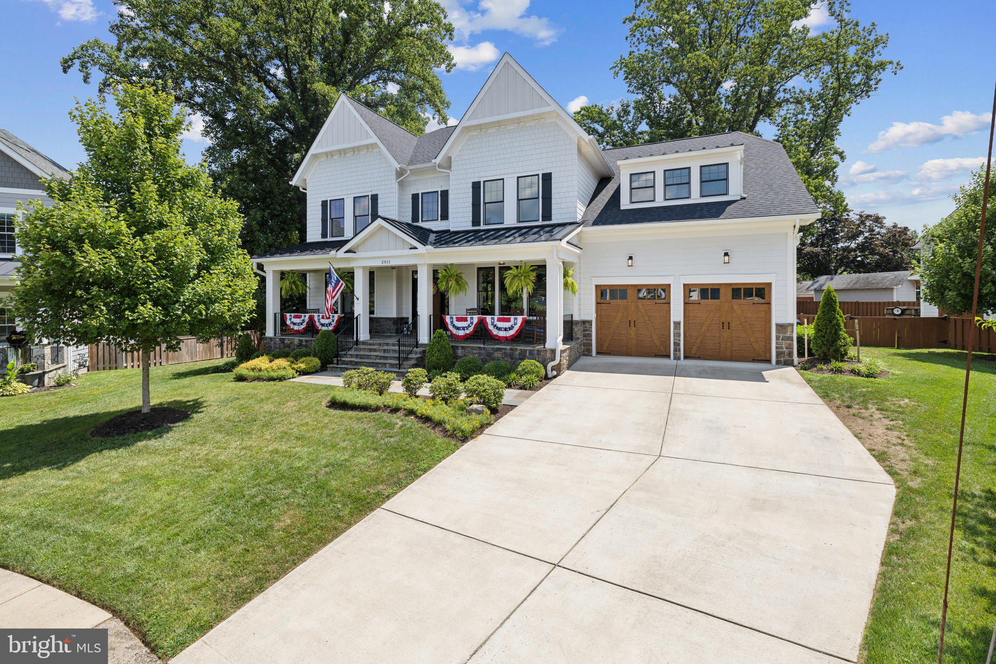 PIMMIT HILLS PERFECTION – Truly one of kind! Taking pride of place in a quiet cul-de-sac, 2011 Kilgore Road abundantly offers all the traditional trappings of an exquisitely tasteful home. From the casual elegance of the coffered ceiling in the family room – featuring a handmade oak fireplace mantel – to the solid and sophisticated hickory hardwood floors, this Pimmit Hills property is bursting with a style that beautifully respects timeless good taste. But tour this wonderful offering with just a bit of scrutiny, and you’ll discover that the traditional has been masterfully married to high-tech. With smartphone convenience, you can operate the thermostats, open the garage doors, or engage the security system. Perhaps best of all, this property’s inspired aesthetic and cutting-edge convenience rest on a foundation of expert engineering that will put any owner’s mind at ease. You’ll love the Pella Enduraclad windows, the Hardie-board siding, the premium shingles with transferrable warranty, the heavy-duty expanded mesh gutter guards, the Rockwool sound insulation throughout, and the 9-zone irrigation system. Speaking of irrigation, the wondrously sized, fully fenced yard of this suburban spread puts 2011 Kilgore over the top. From the large rear deck, which alone easily accommodates outdoor entertaining, step down to a smart flagstone terrace, featuring a regal hearth. Essentially flat, yard maintenance is a breeze. All you need to do is enjoy your own great outdoors. Though even nature gets a boost at this enviable address, with Tysons Pimmit Park practically at your doorstep. The perfect placement also offers a neighborhood Trader Joe’s just beyond, and a thriving neighborhood library. Of course, with a full charge, considering 2011 comes complete with EV/RV charging outlets, you can hit the road, whether RT 495, RT 66, or the Dulles Toll Road with ease. You are invited to tour and see for yourself that 2011 Kilgore Road offers all of this and so much more! From the moment you step up onto the broad, stone front porch – a sublime spot for taking in a sunset – and into the elegant foyer, you’ll agree that this grand home is in a league of its own. You’ll immediately imagine the memories you’ll make over a feast in the formal dining room with tray ceiling, or in the warmly welcoming gourmet kitchen. Let yourself get lost in the pampering primary suite, where dual walk-in closets, private sitting area, spa bath, and balcony retreat promise sweet dreams nightly. Altogether, 2011 Kilgore Road truly presents all the hallmarks of quality. It is six bedrooms, five baths, and undeniably five stars.