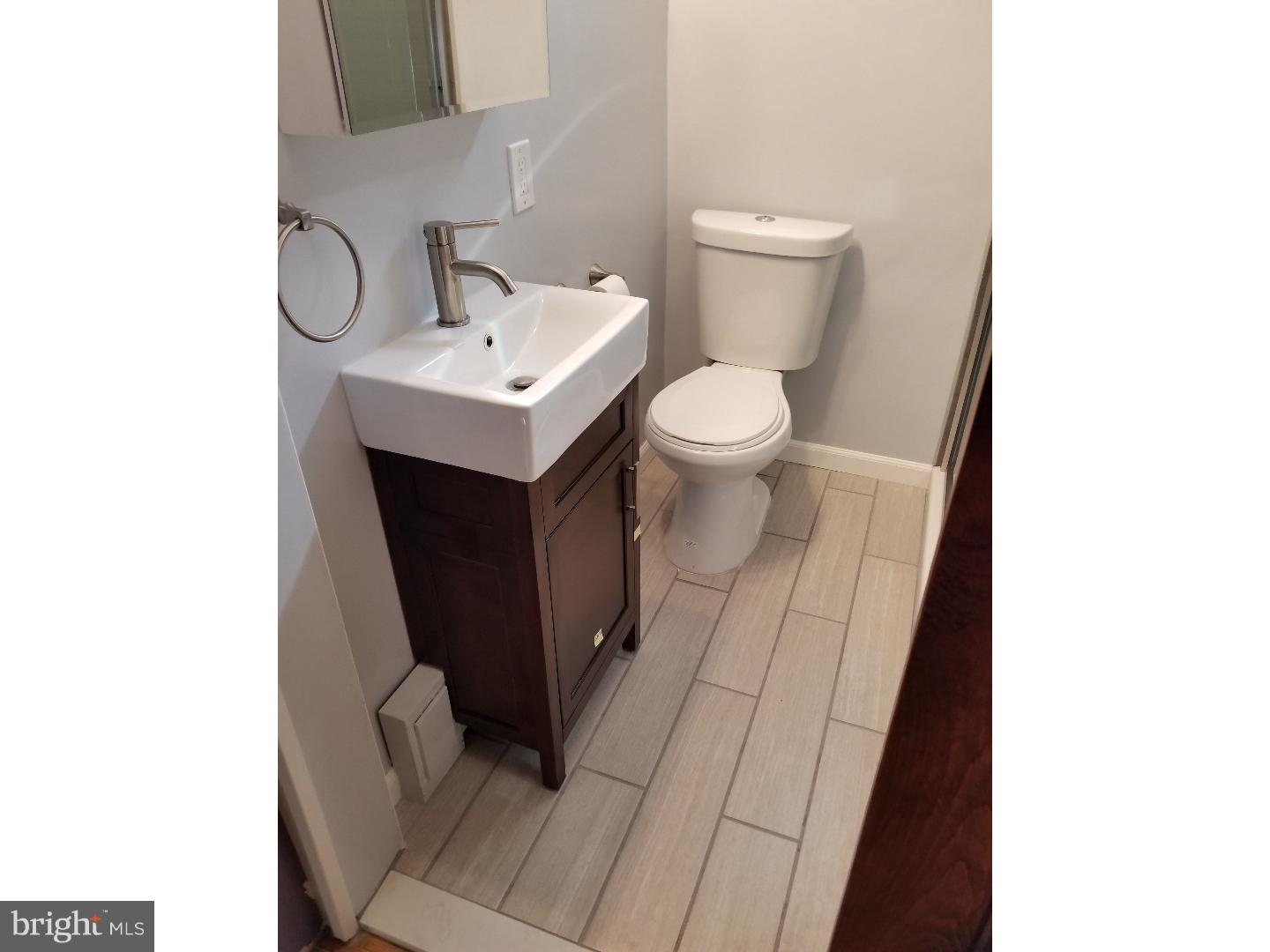 renovated 2 bedroom porch front house in Fishtown.  Excellent location.  Open spacious livingroom/kitchen on the first floor with a half bathroom.  sliding doors open to a deck and nice sized backyard.  Hardwood floors throughout the first floor. Brand new carpet throughout the 2nd floor. Upstairs 2 large bedrooms and a renovated tiled bathroom with walk in shower. European split system air conditioning.  Close to Girard Avenue, restaurants, bars, shopping, Penn treaty Park, etc..