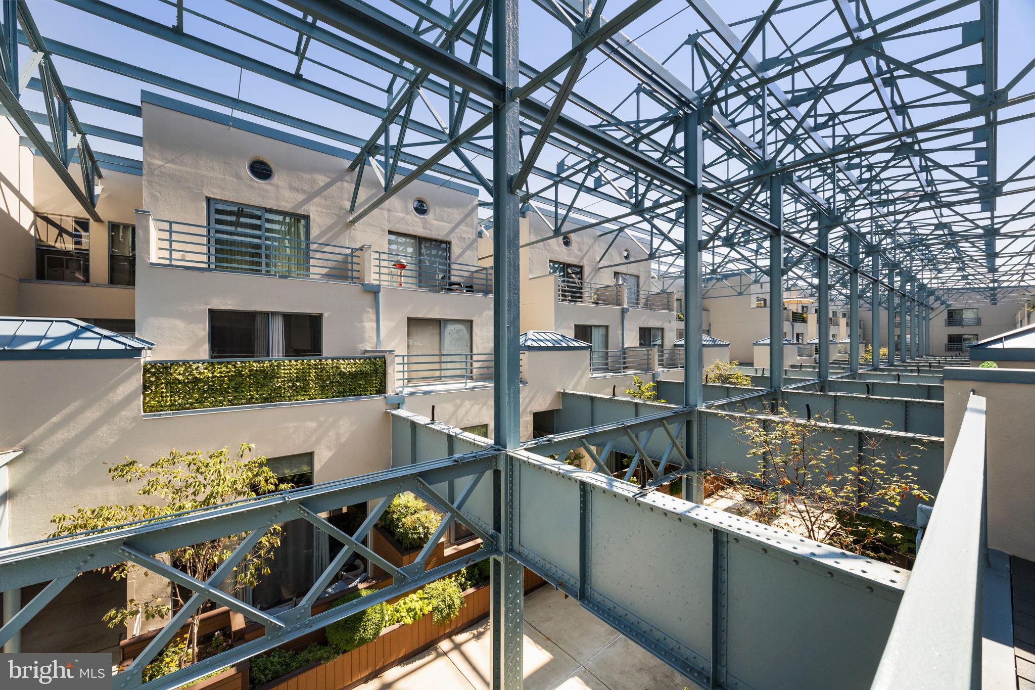 Say hello to Unit PL236 at Pier 3!  This sun-drenched, bi-level one-bedroom, one-bath residence comes with garage parking and two private outdoor spaces.

As you enter, you are welcomed into a large foyer anchored by an architecturally interesting spiral staircase and stylish black-and-white tile flooring, including a convenient coat closet, an in-unit washer/dryer, and a modern kitchen featuring updated appliances, ample cabinetry, and a serving bar. The open-concept living area boasts soaring 12+ ft ceilings, updated bamboo floors, and an expansive wall of windows with sliding glass doors that lead to the first of two private terraces overlooking the building’s verdant interior atrium, capped by its signature open-air steel beam structure. Upstairs, you’ll find the spacious bedroom with a generous closet, the second private outdoor terrace, a hall linen closet, and a full bath with an updated shower stall.

Pier 3 amenities include an indoor heated pool, a fitness center, secure covered garage parking, a common outdoor water-facing deck, a central landscaped atrium, a full-service 24-hour concierge, and professional on-site management. It’s time to enjoy waterfront life and take advantage of the newly finished Delaware River Trail's public amenities, including running, walking, and biking lanes, lush landscape beds, and remember, be on the lookout for your future neighbor, the much-anticipated Park at Penn’s Landing! *Some photos are virtually staged.*