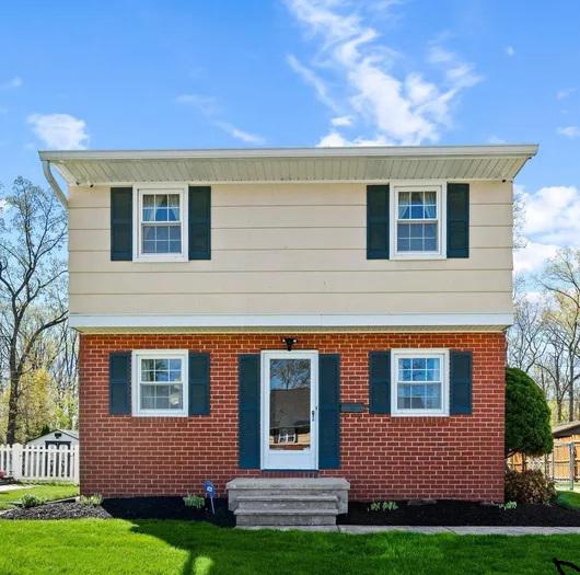 Looking for space that fits your lifestyle? This 1,656 sq ft, 2-bedroom home offers room to live, work, and unwind. It is currently configured as two spacious primary suites, but the owner will convert it back to a traditional 3-bedroom layout prior to settlement if you prefer. Every square foot is designed with comfort and flexibility in mind. The owner has completed numerous significant upgrades, including a new electrical panel, hot water heater, roof, HVAC system, updated kitchen, modern appliances, and vinyl windows with a lifetime warranty. *Bonus alert*—hardwood floors are hidden under the carpet in the living room, stairs, hallway upstairs, and bedrooms, offering an exciting opportunity to reveal and restore classic charm. Pride of ownership is evident throughout! Additional features include a finished lower level that adds valuable space perfect for a family room, recreation room, home office, or exercise area. Enjoy the outdoors with the covered back patio setup for relaxing or grilling, alongside a large, versatile backyard. Well-maintained homes with this level of care and flexibility are hard to find.