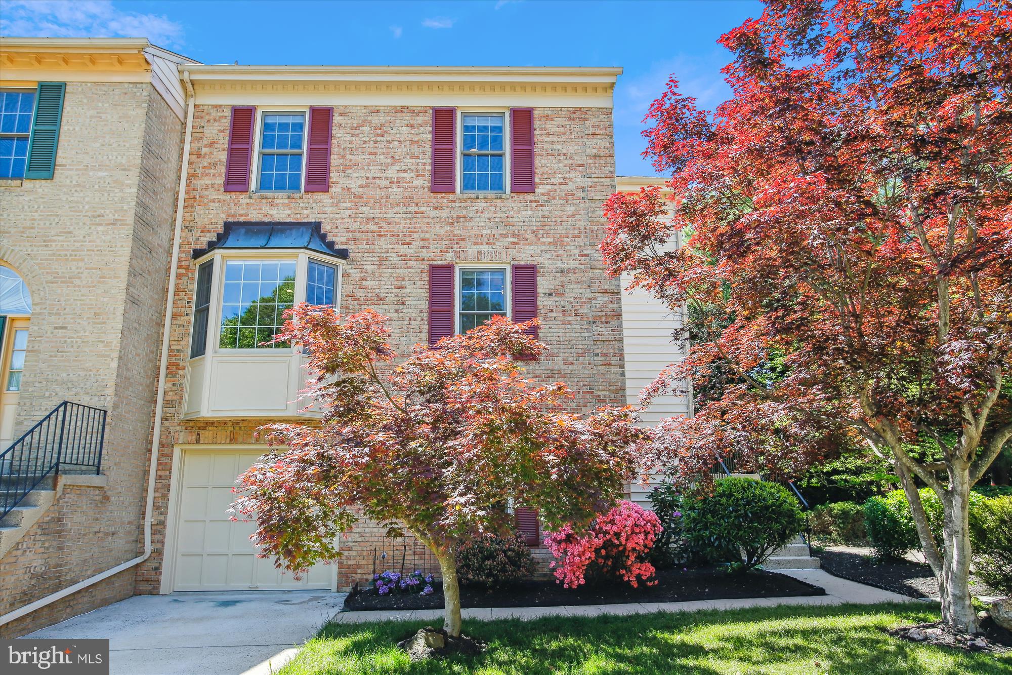 "Any offers received will be reviewed on May 6" 
Welcome to Luxberry Drive – A Rare End-Unit Gem in the Sought-After Kingsberry Community!

Step into this beautifully updated and spacious end-unit townhome, ideally situated on the largest lot in the neighborhood. From the moment you enter, you’ll appreciate the thoughtful upgrades and inviting layout designed for both everyday living and effortless entertaining.

Upstairs, the main level welcomes you with a bright and airy formal living room, complete with a cozy brick fireplace and a skylight that floods the space with natural light. The seamless flow continues into the elegant dining area, which opens directly to an expansive deck—perfect for dining al fresco or enjoying your morning coffee while overlooking a fully fenced backyard with lush, private views.

The renovated kitchen (2020) is a true showstopper, featuring bold black-painted wood cabinets, gleaming quartz countertops, stainless steel appliances—including a newer refrigerator (2023)—classic subway tile backsplash, and a convenient overhang breakfast bar. An oversized eat-in area off the kitchen offers the perfect gathering space, all with serene views reminiscent of a cherry blossom park.

Upstairs, brand-new carpet with upgraded padding leads you to the spacious primary suite. This peaceful retreat boasts a luxurious ensuite bathroom with a large vanity, soaking tub, and separate stall shower. Two additional bedrooms and a full hallway bath complete the upper level.

The walk-out lower level adds even more versatile living space with brand-new luxury vinyl plank flooring, a second fireplace in the recreation room, a half bath, and a separate shower in the utility area. Step out to the beautifully landscaped backyard, complete with a paved patio under the deck—ideal for entertaining or relaxing in your own private oasis.

Additional highlights include an updated washer and dryer, generous storage, a one-car garage with a private driveway, and extra assigned and guest parking. Enjoy fresh paint throughout, a newer microwave, updated countertops, a refreshed primary bath shower, and so much more.

Location is unbeatable—just minutes to community pools, shops, dining, commuter routes, and Pentagon bus lines. Plus, you're within walking distance to George Mason University and moments from the charm of downtown Fairfax.

Don’t miss your chance to own this exceptional home in one of Fairfax’s most desirable neighborhoods!