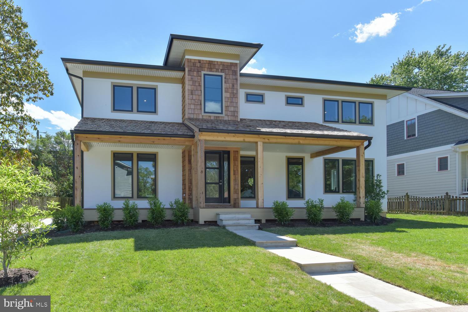 You are going to fall in love with this Pacific Northwest style - meets Northern Virginia chic in this beautiful Arlington Designer Homes original. Seeking a large, flat .22 acre lot in a North Arlington community? Look no further! You have found a fantastic cul-de-sac community, gorgeous home, and terrific location in sought after Arlington. From the flexible living space of the main level that has an optional main-level master or guest suite in the office space, should you need multi-generational living, to the full au-pair suite in the basement, this 5 bedroom, 6 bath home has everything you could possibly be looking for in North Arlington. Need an extra office or studio space? Wonderful! You have it upstairs on the second floor with the bonus room adjacent to the owner's suite.  Want to create a home gym, or possibly a media room? There is space for this in the basement. Need storage, and we're not talking about the actual 2 car garage- you have tons of storage in the basement  in the mechanical room!   Have some fun at the fully built-out finished wet bar is ready for you to enjoy your fantastic basement space as well- want to customize it, certainly, anything is possible! Are you the chef-sort? Have a field day with the immense counter space, veggie-prep area and thoughtfully designed kitchen/ dining lounge area.  You will absolutely love the way you live in this open, airy, bright home with access high-performance features that bring you comfort and style while enjoying all of the conveniences of North Arlington's Lee Harrison shopping district, Lee Highway shops and dozens of parks and trails. If an open concept is what you desire, with the right amount of privacy and space, look no further, as you will have a fantastic flow from the front office and veranda perfect for al-fresco dining and coming on up to the front porch. Sink into your evenings on the back patio or grab a cup of tea and snuggle up in the lovely master-suite and read a good book. Come on up to the front porch and  be welcomed home to Greenbrier.