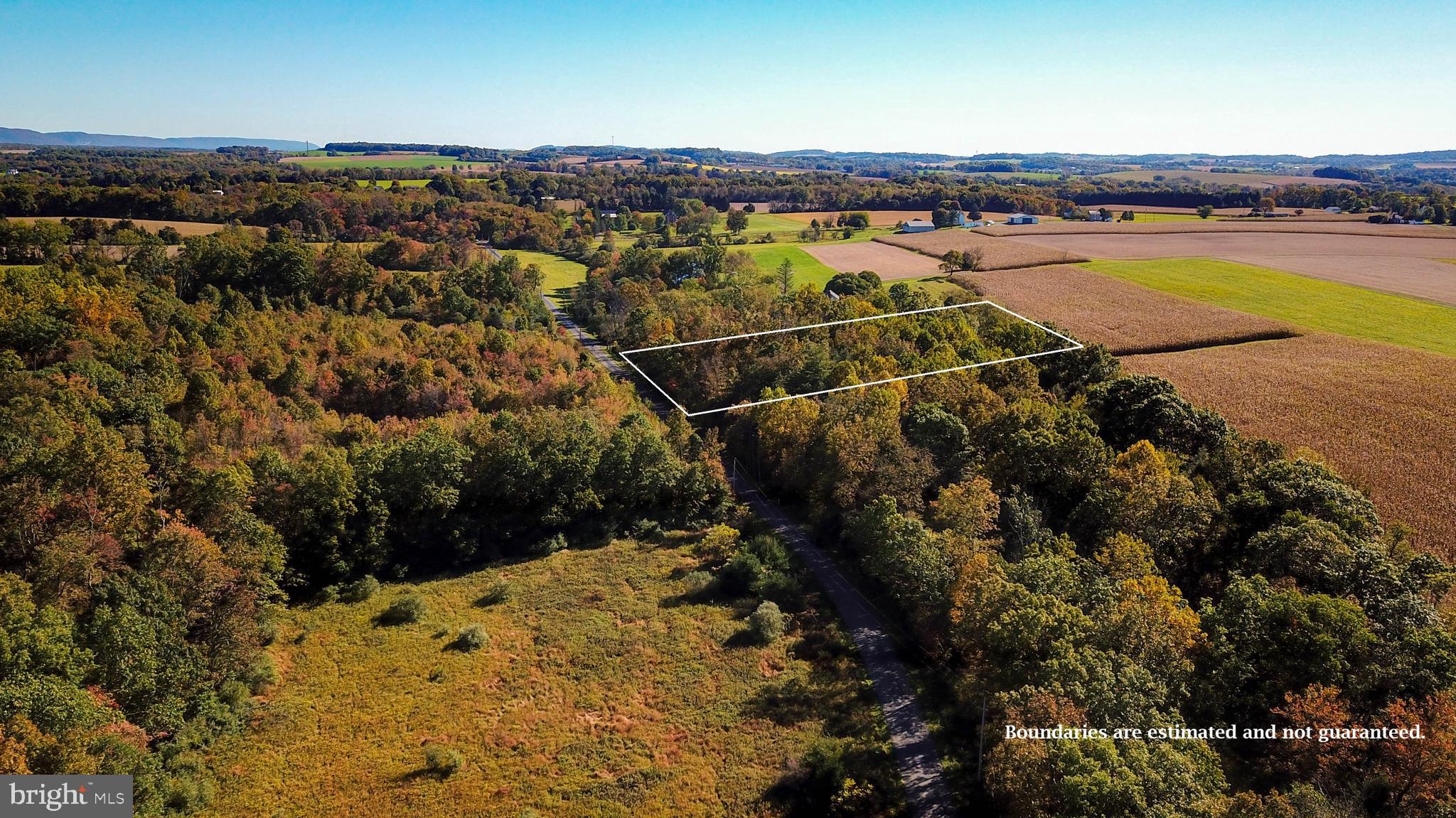 This 2 acre land lot in Lynn Twp and Northwestern Lehigh school district is surrounded by wooded privacy, other large lots, and farm fields for the utmost in privacy and serene surroundings. Peaceful area to relax, yet close enough to RT 78, lakes, parks, winery, golf, shopping, and restaurants. Creek runs through property. Would be possibly only for recreation and not building. 6 Acres across the street also available for sale. Appointment only please - Contact us today for details. (photo boundaries are approximate and not guaranteed)