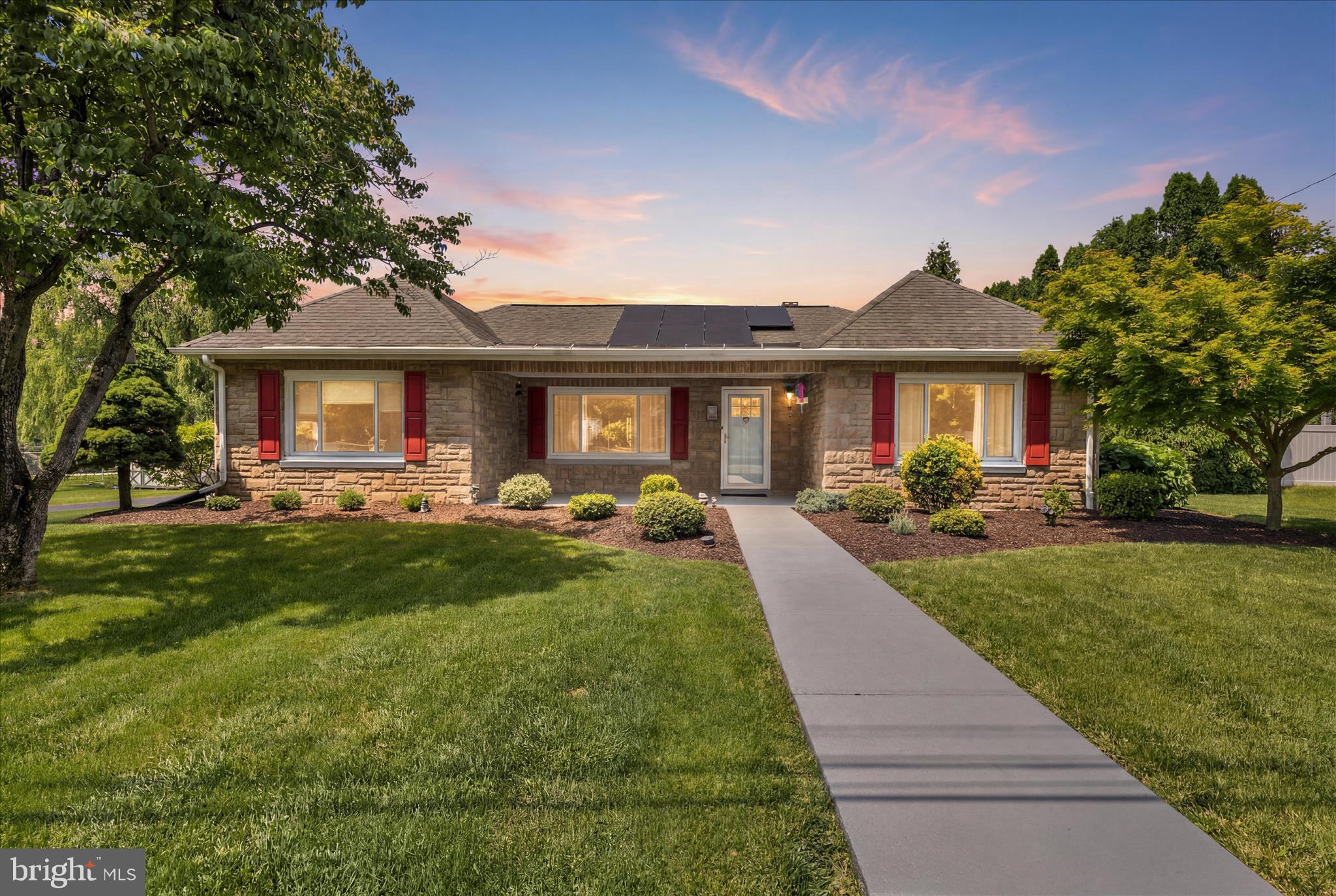 This charming ranch-style home was beautifully renovated in 2008, adding a luxurious en-suite bathroom, walk-in closet and laundry area in the primary bedroom as well as completely renovating the kitchen and second bathroom, and adding an oversized detached garage/workshop. Nestled in desirable Willow Street, this home features three spacious bedrooms, two full bathrooms, and a cozy sunroom, making it an ideal retreat for relaxation and entertaining. Step inside to discover an inviting open floor plan adorned with many upgrades that add a touch of sophistication. The heart of the home is the well-appointed kitchen, complete with upgraded countertops and cabinets, new stainless steel refrigerator, an island large enough for casual dining, and a cozy propane stove. The adjoining dining room is perfect for hosting gatherings and special occasions. Natural light pours in through the large replacement windows, enhancing the warmth of the living spaces. The primary suite boasts a walk-in closet and a private bath, ensuring a serene escape at the end of the day. Additional features include a convenient main-floor laundry with front-loading appliances and built-in cabinets. The full size unfinished basement provides plenty of opportunities for additional living space as well as a separate workshop with bult-in shelving. Outside, the expansive 0.33-acre lot offers a beautifully landscaped yard, a spacious front porch, back patio and a gazebo, perfect for entertaining or quiet moments. The property includes both an attached one car garage as well as a detached one car garage that could be used for additional parking, a workshop or a storage shed, providing plenty of storage and parking options. The energy efficient solar panels are only two years old and have a transferrable lease that is $85/month. The seller's average electric bill in 2025 was only $29/month! With its excellent condition and thoughtful design, this home is ready to welcome you into a life of comfort and joy. Don't miss the opportunity to make it your own!
