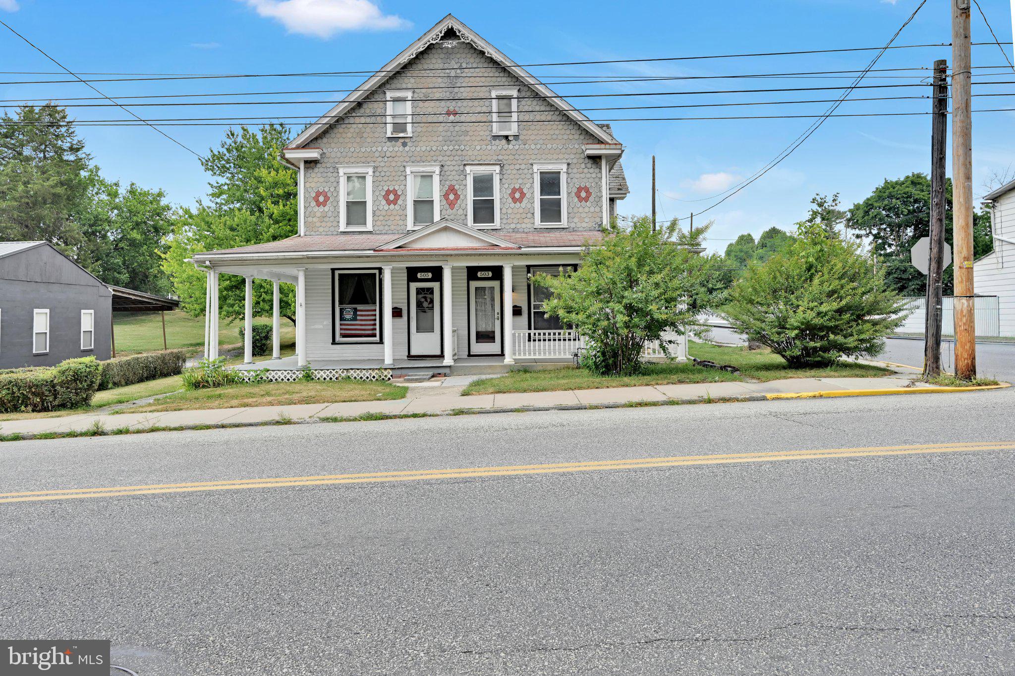 Welcome home to this charming semi-detached traditional home situated on a desirable corner lot in the heart of Annville! Offering 1,692 square feet of living space, this well maintained property features 4 spacious, hall-entered bedrooms and a full bath on the second floor.  The first floor offers exceptional flexibility with a formal living room, formal dining room, generous family room, and a large eat in kitchen providing endless possibilities for entertaining, working from home, or creating additional living spaces. The kitchen includes a dishwasher, refrigerator, and stove, while the first-floor laundry comes complete with a washer and dryer for added convenience.  Freshly painted and featuring newer windows, a newly installed central A/C unit, gas heat, and an unfinished basement for abundant storage, this home is move in ready. Step outside to enjoy both covered front and rear porches overlooking the beautifully landscaped, level yard. A detached garage and off-street parking add even more value and convenience.  Located on a .13-acre corner lot, this property combines timeless character with modern updates and is ready for its next owner. Some photos have been virtually staged to help showcase the home's potential.