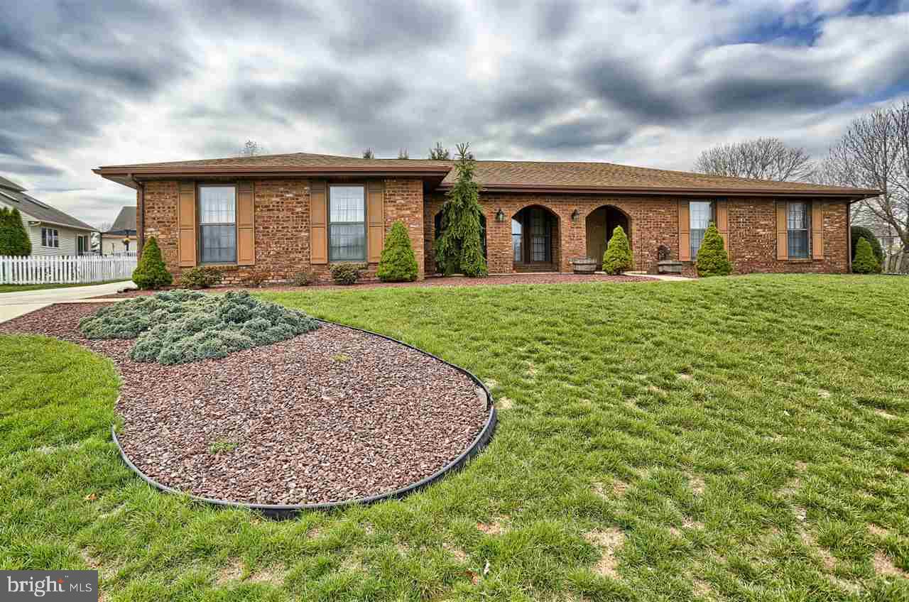 Beautiful all brick rancher that sets perfectly on a mature, tree lined lot that offers natural privacy! The home flows very well and you find yourself loving the enclosed sun room that has an oversized hot tub as well as plenty of extra space to enjoy the views of the private lot! Quality and custom upgrades are found both full baths and all the flooring has been updated nicely!  There's plenty of parking & extra space in driveway for your toys!
