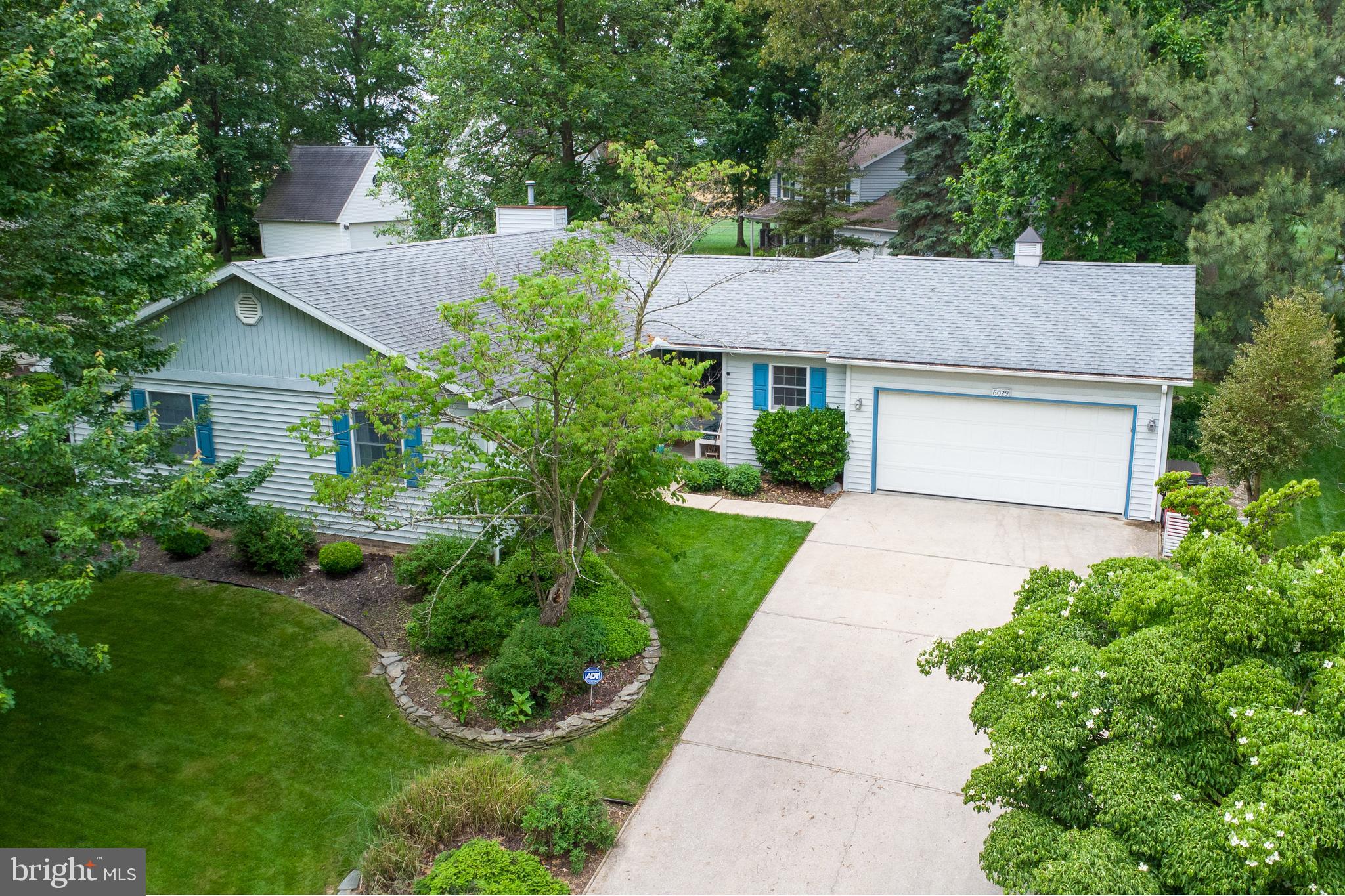 Welcome to easy one-level living in the prestigious Penn National Golf Course community. This beautifully maintained home offers the perfect combination of comfort, quality, and style. The spacious interior features custom cherry cabinetry crafted by Hess Cabinets, adding timeless character and exceptional craftsmanship to the kitchen space.

Warm acacia wood flooring flows throughout the home, complemented by a cozy gas fireplace in the living room, creating an inviting atmosphere for relaxing or entertaining. The temperature-controlled sunroom provides additional year-round living space, perfect for enjoying morning coffee, reading, or hosting guests.

Offering 3 bedrooms and 2 full bathrooms, this home is thoughtfully designed for convenience and functionality. An extra-large 2-car garage provides ample room for vehicles, storage, and hobbies. Enjoy the peaceful setting and sought-after lifestyle this exceptional golf course community has to offer.
