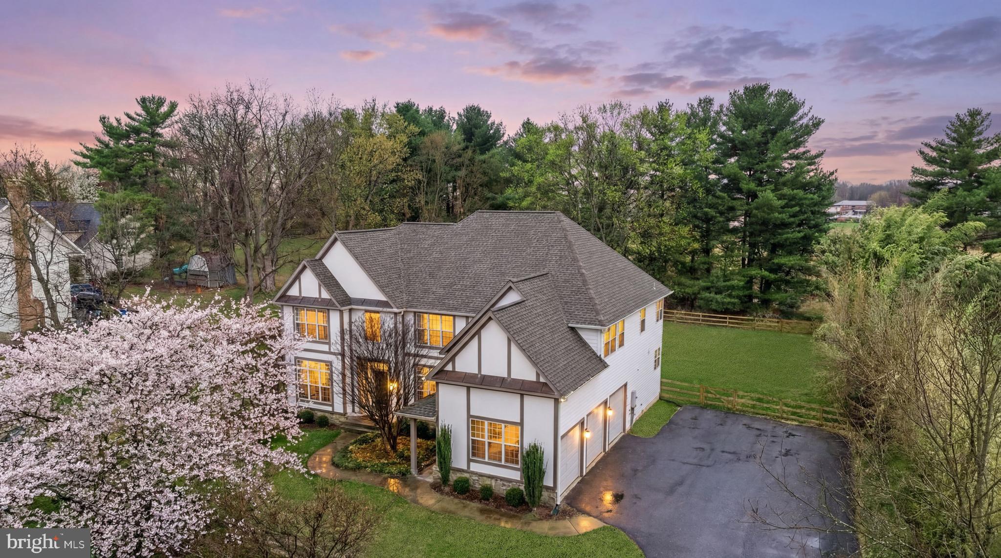 Set well back on a private, level three-quarter-acre lot backing to a quiet treeline with open pasture views, this fully renovated Darnestown estate trades the noise of denser suburbs for genuine seclusion — without giving up a single modern comfort. The 2024 renovation was taken down to the details: new hardwood floors, a gourmet kitchen anchored by an oversized quartz island and professional-grade appliances, and beautifully selected finishes throughout nearly 5,800 square feet of light-filled living space.
The layout is built for the way families actually live now. A main-level office makes working from home effortless, while the finished walk-out lower level — with a full bath, wet bar, and a generous recreation room — offers a true private suite for extended family, guests, or a teen retreat. Upstairs, the primary suite features a spa-style bath and walk-in closets, with three additional bedrooms and flexible bonus space that adapts to whatever you need: gym, studio, or playroom.

Outside, dual slate patios overlook the trees and the gentle slope of the rear yard, with room to roam, garden, or simply unwind in complete privacy. A side-load three-car garage and a long, welcoming approach round out the package. No HOA, public water, and a peaceful rural-residential setting just minutes from shopping, commuter routes, and Mary of Nazareth — within the Northwest High School district. Move-in ready and waiting for its next chapter.