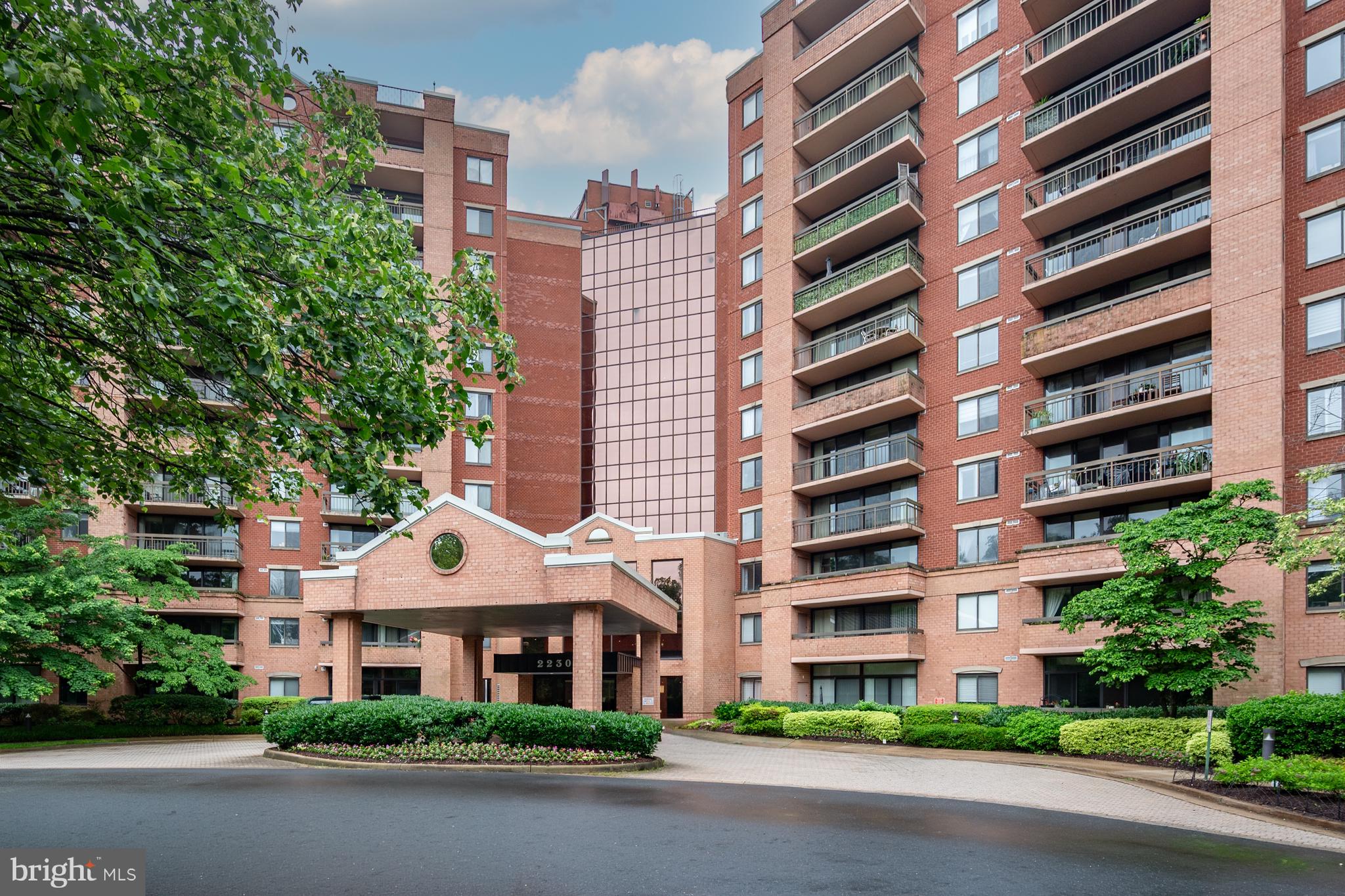 Not all condos are created equal — and this one offers the best of Tysons proximity without the noise and bustle. Situated on the building's eastern side, it faces away from the beltway, so you get soft morning light and genuine quiet, without giving up a single inch of the location's upside. The Renaissance 2230 is a short drive to Tysons, a quick hop to I-495 and Rt 7, and there's a free shuttle to West Falls Church Metro when you'd rather leave the car parked in your reserved space. Inside, 1,074 square feet opens up in all the right ways: a living and dining area with engineered wood floors that flows straight out to a large balcony through a full wall of sliders. Kitchen with granite counters, stainless appliances, cherry cabinetry — the details are solid, not an afterthought. A stacked washer/dryer means no schlepping laundry anywhere. The primary bedroom has a proper walk-in closet and an ensuite bath. The second bedroom sits right across from the second full bath. Everyone gets their own space. Two assigned storage units mean the apartment space is all for living – not cramped with rarely used items.  And with fresh paint, the unit is ready for you to move in and make yours.  The community is hard to beat: a 9 story building with exceptional amenities including an outdoor pool, tennis courts, a fitness center, picnic area with grills, 24-hour security, EV charging area, and more. The community is gated and the front desk staffed 24/7. Plenty of unassigned parking for visitors. Condo fee includes parking and water/sewer; owner is responsible for electricity.