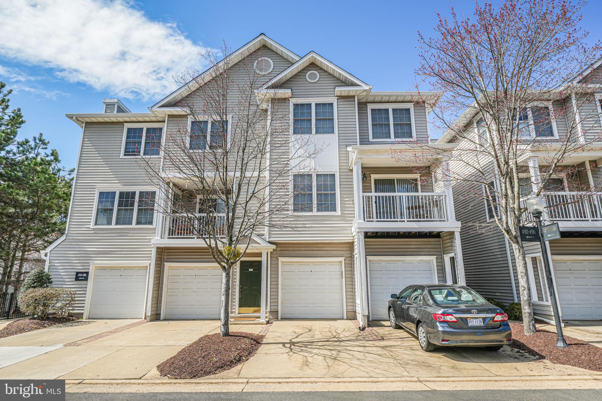 Stylish 2-story, townhouse condo in lovely sought-after Fair Lakes gated condo community -- main level open floor plan connects living/dining/kitchen with hardwood floors and gas fireplace; sliding glass doors leading to balcony/outdoor living space. Kitchen has ample storage and counter space; bar connecting to separate dining area, for additional seating. Two bedrooms and two full baths, with laundry on private lower level. One car garage attaches to kitchen entry; space in driveway for an additional vehicle. Newer washer, dryer, and microwave oven. Outdoor pool, clubhouse, fitness center are included in the amenities. Dining and shopping nearby; close to I66, Fairfax County Parkway, and Route 50.