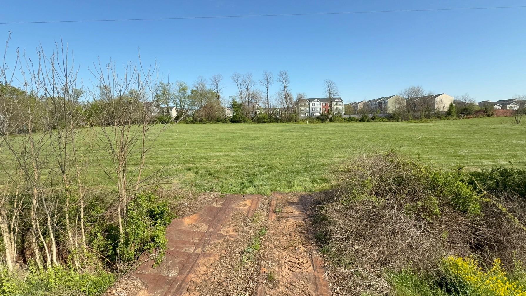 2.63 acres of prime commercial property near downtown Taneytown, directly in front of Meade's Crossing. The lot is cleared, level, and faces FSK Hwy/Rt 194, but sits back along MD853E with plans from State to extend paving to lot by late Fall of this year from Angell Rd.  Existing public water and sewer connections.  Owner financing available.