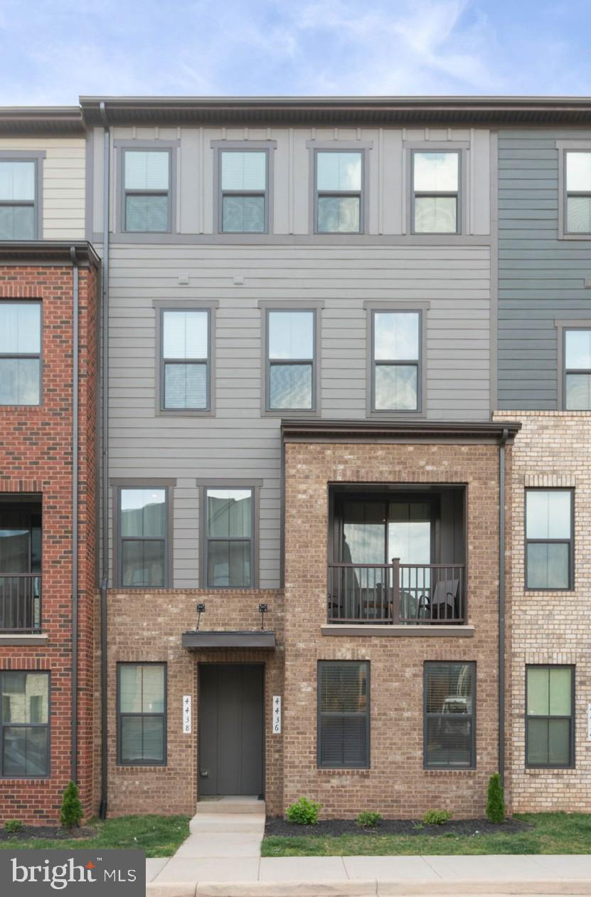 Welcome to 4436 Field Gate Ln, where modern design, a thoughtful layout, and low-maintenance living come together in the sought-after Ellipse at Westfields community. Built in 2024, this 4-level townhome-style condo offers a fresh, move-in ready feel with well-designed spaces that adapt to today’s lifestyle.

The entry level features a versatile recreation room and half bath—ideal for a home office, fitness space, or additional living area—along with convenient access to the attached 1-car garage. Upstairs, the main living level is bright and open, anchored by a well-appointed kitchen with quartz countertops, a center island, white cabinetry, gas cooking, stainless steel appliances, and a stylish backsplash. The kitchen flows seamlessly into the dining and living areas, creating an inviting space for both everyday living and entertaining.

The upper levels are designed for comfort and privacy. The primary suite offers a spacious retreat with a walk-in closet and a private bath featuring a dual vanity and a walk-in shower. A conveniently located upper-level laundry area enhances everyday ease. Two additional bedrooms and a full bath provide flexible space for guests, a home office, or evolving needs.

A covered balcony extends your living space outdoors—perfect for enjoying morning coffee or unwinding at the end of the day. With contemporary finishes throughout and a low-maintenance lifestyle, this home offers the ideal blend of style and functionality in a prime Chantilly location just minutes from shopping, dining, and major commuter routes.

Some photos have been virtually staged to help illustrate the potential use and layout of the spaces.