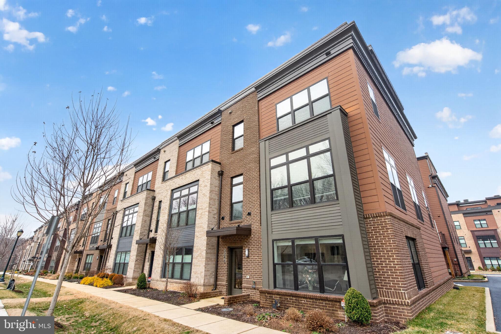 BEST VALUE IN TOWER OAKS RESERVE !! LARGEST LUXURY 4 LEVEL END UNIT-ELEVATOR-ROOFTOP TERRACE!!Welcome to Rockville’s sought-after Tower Oaks community! This beautifully designed modern townhome is the LARGEST of the models (DRAKE) with 2,720 sq ft,  in home ELEVATOR and located on an OPEN QUIET CORNER   ! Freshly painted throughout and carpets replaced with beautiful wood floors!! Stylish, low-maintenance living with a spacious open layout, contemporary finishes, and thoughtfully designed indoor-outdoor flow across four impressive levels. The ENTRY  level features a versatile and light-filled office, den or bedroom with an elegant built in bookcase and French doors, a full bathroom, and access to the attached two-car garage. The MAIN living level with hardwood floors is designed for both comfort and entertaining, featuring expansive open-concept living and dining spaces, a beautifully appointed kitchen with quartz countertops, stainless steel appliances, abundant cabinetry, and a large center island. Enjoy a sunny breakfast area with an additional built in pantry / coffee station,  a separate dining space, and easy access to a spacious balcony off the kitchen, perfect for morning coffee or dining al fresco. The living room is anchored by a cozy gas fireplace with TV setup. The THIRD level offers a truly spacious primary suite with a large custom-organized walk-in closet and a luxurious en-suite bath. This floor also includes a second bedroom with en-suite bathroom as well as a conveniently located laundry room. The TOP FOURTH level provides exceptional flexibility with a generous family room opening to a private rooftop terrace, offering the perfect setting for entertaining, lounging, or future customization with the potential for an indoor kitchenette or bar area. This level also includes an additional bedroom and full bathroom. Tower Oaks residents enjoy access to The CORE, an exceptional community amenity center featuring a pool, fitness center, yoga studio, club room, café, fire pits, sport court, green spaces, grilling stations, and gathering areas, bringing a true lifestyle component to everyday living. Ideally located near Clyde's Tower Oaks Lodge, Park Potomac, Pike & Rose, I-270, and major commuter routes, this home offers elevated living with exceptional convenience!