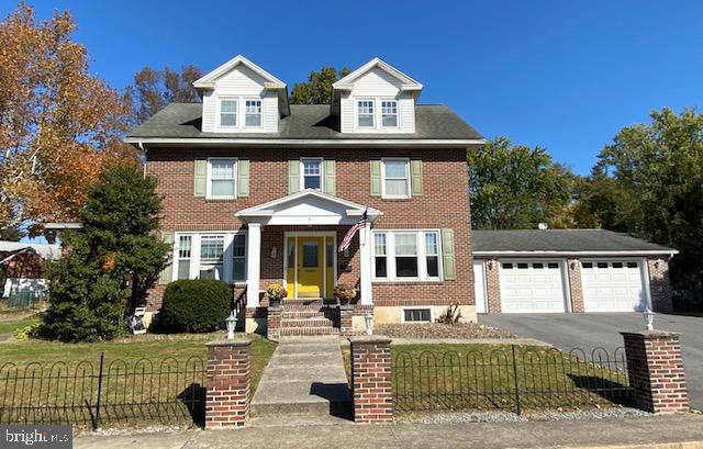 This charming 2 1/2-story brick home is ideally located on the South side of town, offering convenience and comfort. The kitchen features beautiful oak cabinets, Corian countertops, and a breakfast bar, perfect for casual meals. The formal dining room boasts elegant oak floors, while the spacious living room is highlighted by a cozy wood-burning fireplace. A convenient half bath completes the main floor. Upstairs, you’ll find a master bedroom with a 3/4 bath and a walk-in closet, as well as an additional bedroom, a full bath, and a laundry room that leads out to an upstairs covered porch. The third level offers even more space, including a second master bedroom with an attached full bath and an additional bedroom. This home is equipped with natural gas heat and hot water and includes a partially finished basement for extra storage or potential living space. Keep your vehicles protected with the attached two-car garage, which also features a small bonus room. There’s also plenty of off-street parking available in both the front driveway and at the back of the house. The large, level lot provides ample room for outdoor activities and hobbies. Don’t miss out—schedule your showing today!
