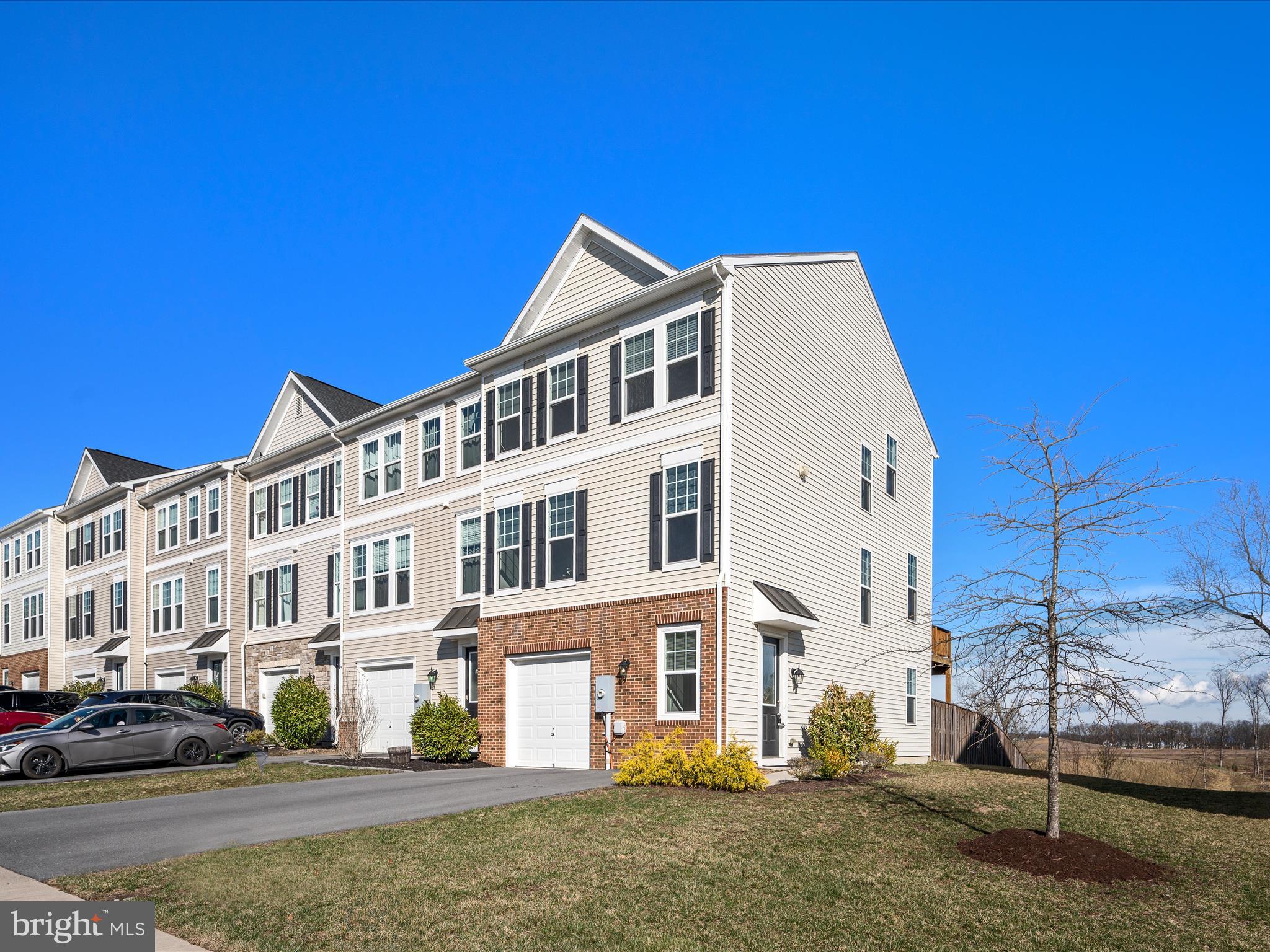 Welcome to this spacious end-unit garage townhome in the highly desirable Fieldstone community! The ground entry level features an attached garage, a full bath, and a large recreation room that could easily serve as an additional bedroom. The second level boasts a modern gourmet kitchen (Brand New Dishwasher March 2025), expansive living room and dining areas, all with gleaming hardwood floors. Upstairs, you'll find 3 generous bedrooms and 2 full baths. As an end unit, this home is bathed in natural light thanks to extra side windows in every room. Enjoy outdoor living on the large deck, perfect for relaxing and overlooking open spaces and trees. Conveniently located near Highway 81 and Route 7, this home offers both comfort and convenience. Don’t miss out on this incredible opportunity!  ***Brand New Water Heater 12/23****