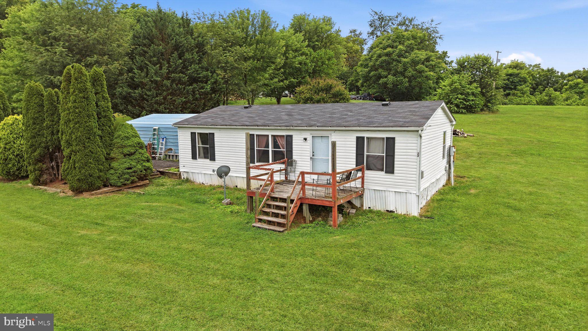 Move-in ready 3-bedroom, 2-bath home that sits on 0.98 acres with NO HOA! Featuring a new roof, updated bathroom, new flooring, and a 4-year-old HVAC. Complete with a 2-car carport and storage shed, offering plenty of space, comfort, and convenience in a great location. This property is ideal for those seeking privacy, room to grow, and country living with everyday convenience. Located in a desirable location with easy access to shopping, dining, schools, and major highways.