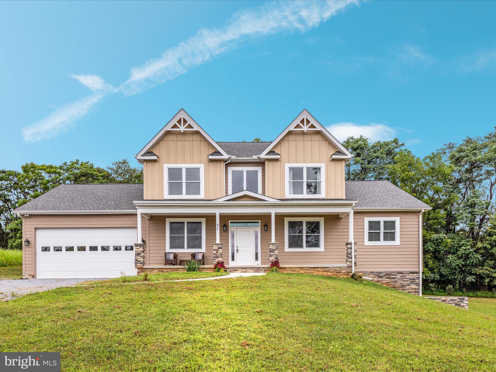 This beautiful custom-built colonial offers the perfect combination of luxury and everyday comfort, set on 2.38 acres of private, picturesque land in the gated community of Crossings on the Potomac. With deep water river access, a community boat marina where power boats are welcome, and just 15 minutes to shopping, dining, and the interstate, this location offers both retreat and convenience.

Inside, the home features a dramatic two-story family room with a gas log fireplace, creating a warm and inviting centerpiece for gatherings. The gourmet kitchen is designed for both style and function with plentiful cabinetry, soft-close cabinets and drawers, stainless steel appliances, a walk-in pantry, and a spacious island. Off the family room, a covered rear porch provides the perfect spot for relaxing and enjoying nature. The main level also includes a primary suite with two walk-in closets and a bath offering dual vanities, a soaking tub, walk-in shower, and private water closet. A separate laundry and mud room and an oversized 3 garage add convenience to everyday living.

Upstairs you’ll find three generously sized bedrooms, including one with a Jack and Jill bath, plus an additional full bath, providing plenty of room for family and guests.

The unfinished basement offers endless possibilities. With full walk-out access to the backyard and a concrete patio just outside the door, this level is ready to be transformed into additional living space. Whether you envision a recreation room, home theater, gym, or guest suite, the basement provides the flexibility to design a space that truly fits your needs.

Additional features of the home include recessed lighting, ceiling fans, UV light, and a covered front porch.

Homes with access to the Potomac River are a rare find. Don’t miss the chance to experience all that this property and community have to offer, schedule your showing today.