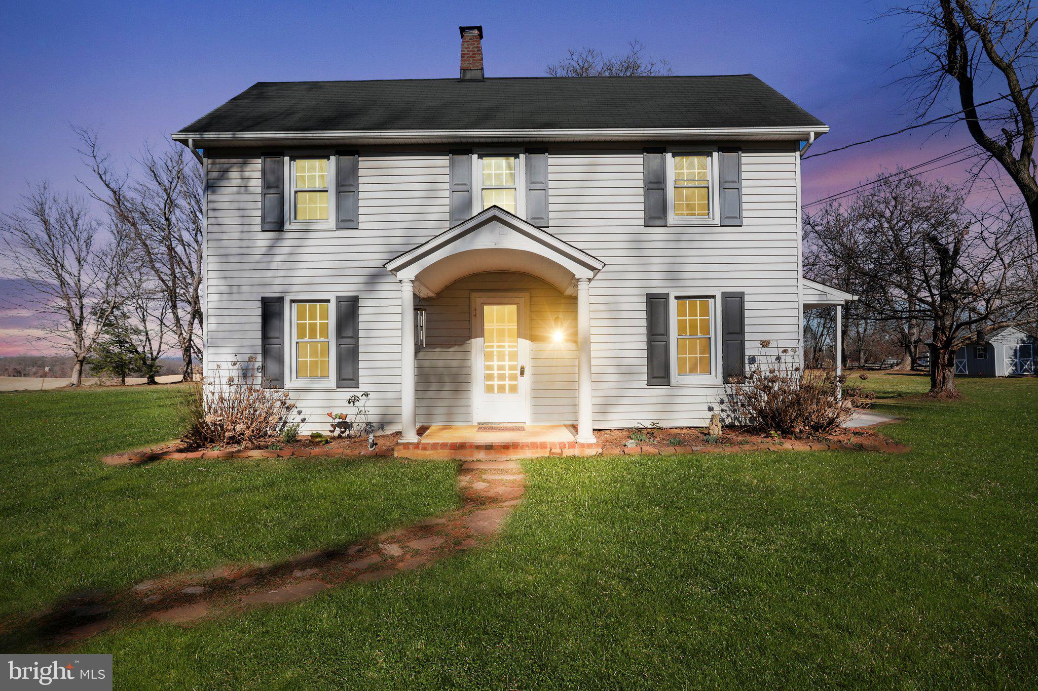 Discover the perfect blend of comfort and serenity in this delightful 4-bedroom home, nestled on a beautiful, flat 1.58-acre lot in Western Howard County. Surrounded by picturesque farms, this property offers a peaceful retreat without sacrificing commuter convenience.  The heart of the home is enhanced by natural light, creating a warm and inviting atmosphere. The property boasts a detached 2-car oversized garage, providing ample space for vehicles and storage. The screened porch offers a tranquil setting to enjoy the surrounding natural beauty, ideal for relaxing evenings or morning coffee. Step outside to the patio and immerse yourself in the meticulously cared-for landscape, featuring an array of trees, plants, and flowers. The expansive yard offers endless possibilities for outdoor activities, gardening, or simply basking in the tranquility of your private oasis. Located in a sought-after area known for its great commuter location, this home is an ideal choice for those seeking a balance of rural charm and accessibility. Embrace the opportunity to make this serene haven your new home, where nature's beauty is your everyday backdrop.