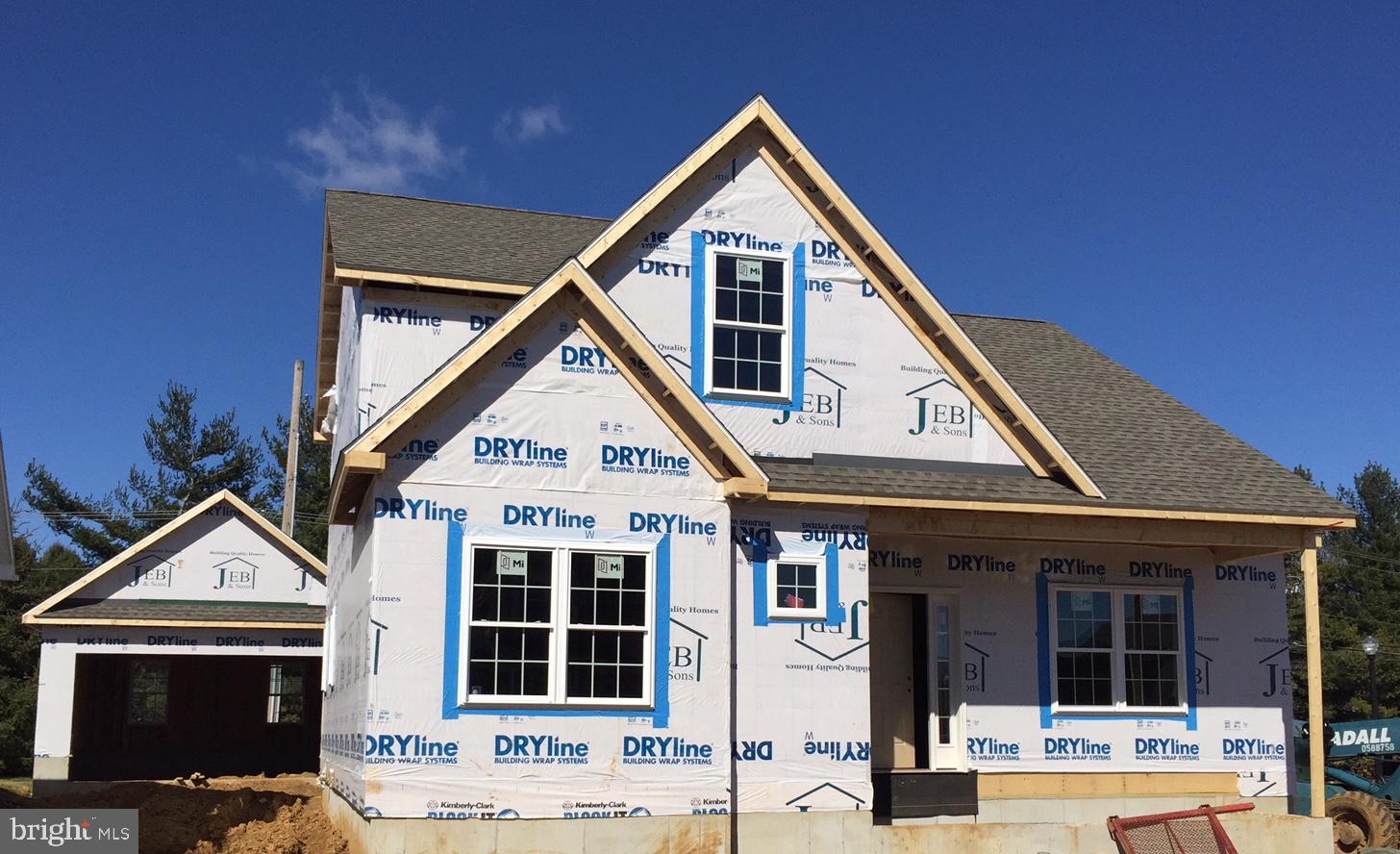 UNDER CONSTRUCTION - Lovely cottage-style home across the street from Richmond Square. Walk to restaurants and shops. Features include 1st Fl Master Suite, open floor plan, hardwood floors, great room w/corner gas fireplace, large kitchen w/island breakfast bar, granite counters. ESTIMATED COMPLETION-SUMMER 2018.