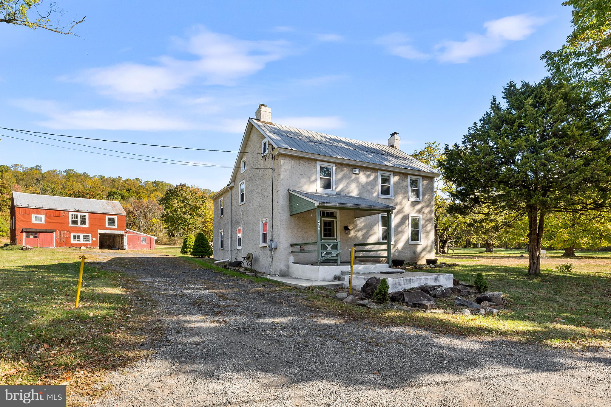 Welcome to 2717 Swamp Pike, a charming farmhouse located in Boyertown Area School District. Now sitting atop 3.19 acres, with an additional parcel included, this house has been well maintained and cared for with fresh interior painting (2024), refinished hardwood flooring (2024), updated carpeting (2024), re-stucco (2021) and maintained steel/black tar roof. Entering the home from the rear, your patio guides you into a mudroom entrance and a large laundry room leads you into your eat-in kitchen featuring an exposed wood ceiling, hardwood floors, dishwasher and electric cooking and room for a kitchen table of your choice. Your formal living room features a large mason fireplace, carpeting and exposed wood beams. Nearby is your family room also with exposed wood beams, refinished hardwood flooring and deep window sills. Additionally on this floor you will find a half bath powder room convenient for guests. Heading upstairs, you will find 4 bedrooms complete with closets, an extra sitting room off the Master bedroom and a full bath to share complete with stand-in shower/tub, bowl sink and tile flooring.  With the added insulation (2023), the third floor could be utilized as an office, playroom, additional bedroom or simply storage; the choice is yours! In addition, there is a large barn located at the end of your drive that consists of 2 stories, 2 1/2 bays and plenty of storage space. This home features updated electrical and plumbing, a brand new complete septic system (2024), a new electric hot water heater (2024), new oil tank (2022) , and recently serviced oil heater (2024) all in addition to the cosmetic updates. This farmhouse offers old world charm with all the new updates, what more is there to ask for? Schedule your tour today while it lasts!