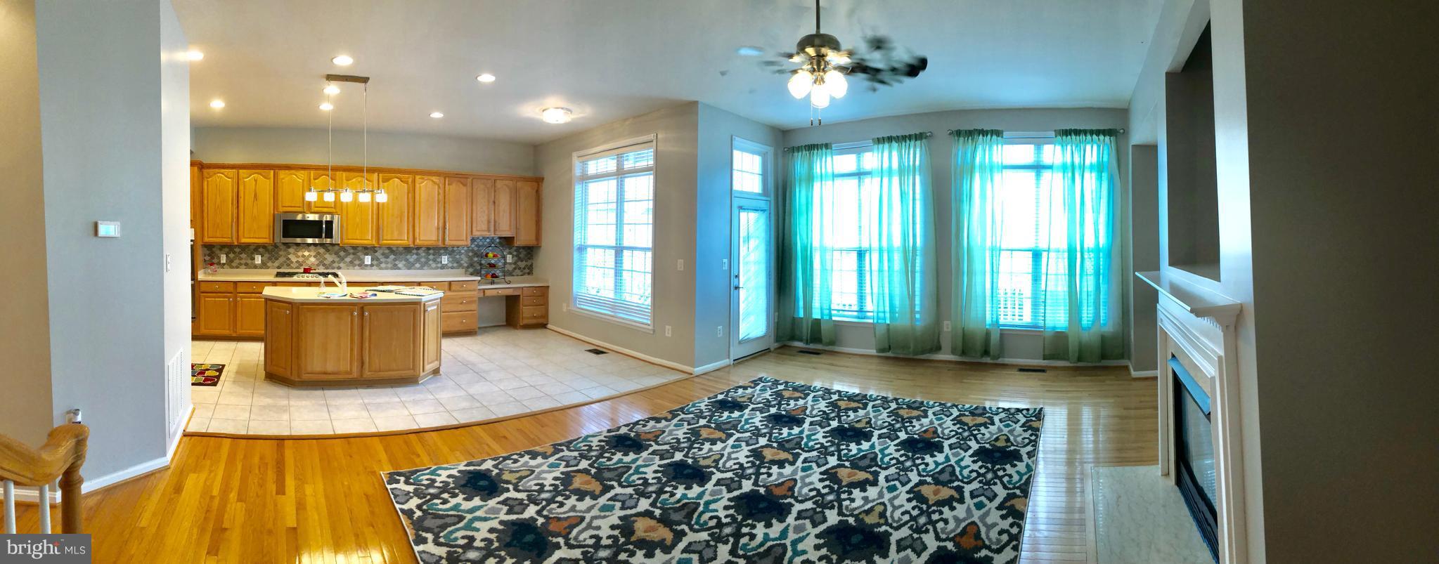 THIS SUPER LUXURY LARGEST 3000+ SQ FT, 30 FT WIDE TH has **3 LVL BUMP OUT**GOURMET KITCHEN W/Quartz CTOP, UPG Newer SS APPLIANCES, HUGE PANTRY . FAUX WOOD BLINDS, CEILING FANS IN UPP BRS & FAM RM!! DOUBLE DECKS FROM MBR SITTING AND FAMILY RM!! UPG BATHS, 2 LVL HWD FLOORS, BASEMENT WITH BR & FULL BA, UPG  CARPET.