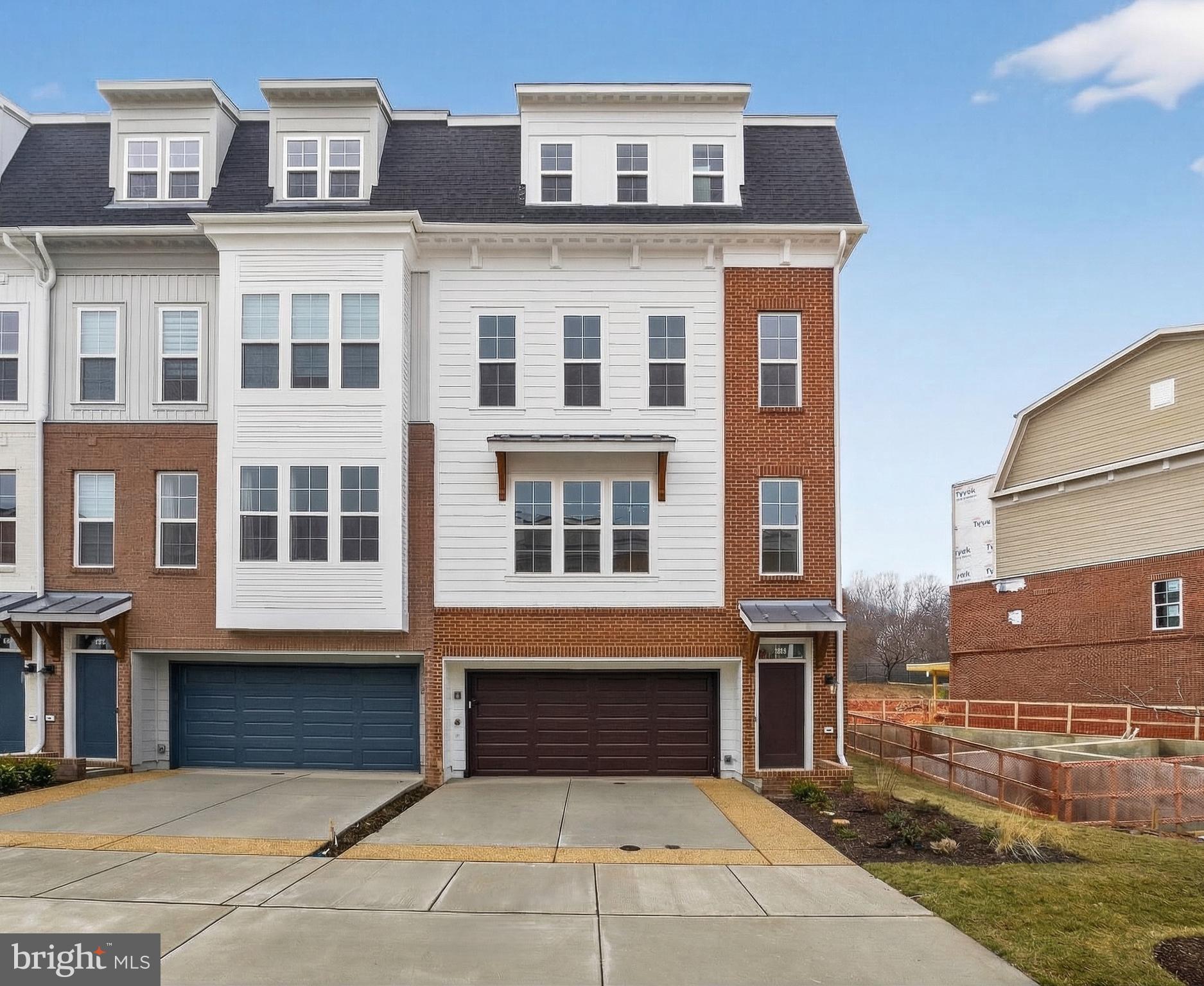 Move in Now!    The Lillian 611 is a 4 level, 3 BR, 3.55 BA end home , 2-car side by side parking garage with 2 parking spaces in the driveway, and rear yard and  rooftop terrace.  The HOA fee includes access to the Barn - a Community Center with Fitness Room, an  outdoor Pool Area, Fire Pits and seating as well as a playground and 1.25 acres of walking trailsl!