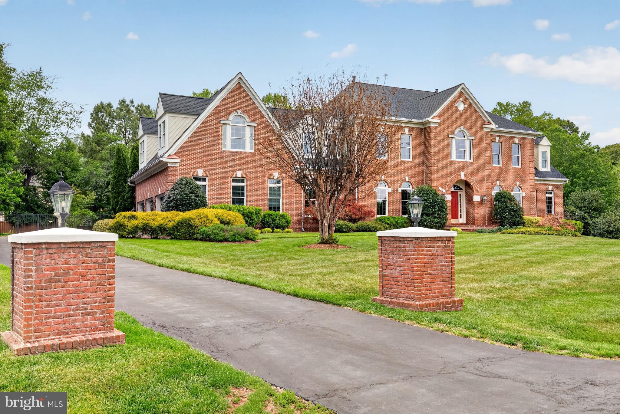 **OFFER DEADLINE Monday, May 18th at 6:00 pm** Nestled within the historic district of Colvin Run Mill, this exceptional colonial estate offers timeless elegance, expansive living space on a premium 1.05-acre lot. Showcasing brick on three sides and nearly 7,000 square feet of refined living space, the home features 5 bedrooms, 5 full baths, 2 powder rooms, and a spacious 3-car garage. Thoughtfully designed with soaring 10-foot ceilings on the main level and 9-foot ceilings upstairs and downstairs, the residence is filled with natural light and an open, airy ambiance throughout. The main level is perfectly suited for both grand entertaining and comfortable everyday living. A sun-drenched side sunroom flows seamlessly into the expansive family room, highlighted by rich hardwood flooring and a striking fireplace. The gourmet chef’s kitchen features a large center island, generous breakfast area, and a catering kitchen complete with an additional sink and full-size refrigerator. A private office and two powder rooms complete the main level.
Upstairs, the luxurious owner’s suite serves as a private retreat, offering a cozy sitting area with fireplace, dual walk-in closets, and a large bath with dual vanities. Four additional upper-level bedrooms include two with ensuite baths and two connected by a Jack-and-Jill bathroom. The lower level provides exceptional flexibility with expansive guest accommodations and abundant space for a future theater, recreation room or fitness area. Outdoor living is equally impressive, featuring a beautifully landscaped mature backyard and a private sport court ideal for pickleball, tennis, or basketball.
Ideally located in one of Great Falls’ most sought-after neighborhoods, this remarkable residence offers privacy and convenience just minutes from Tysons Corner, with access to top-rated Great Falls schools.